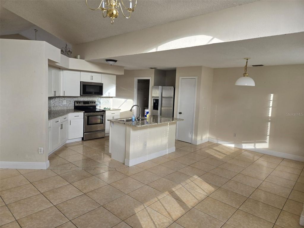 Photo of 387 Blue Bayou Drive, Kissimmee, FL 34743 (MLS # S5143678)
