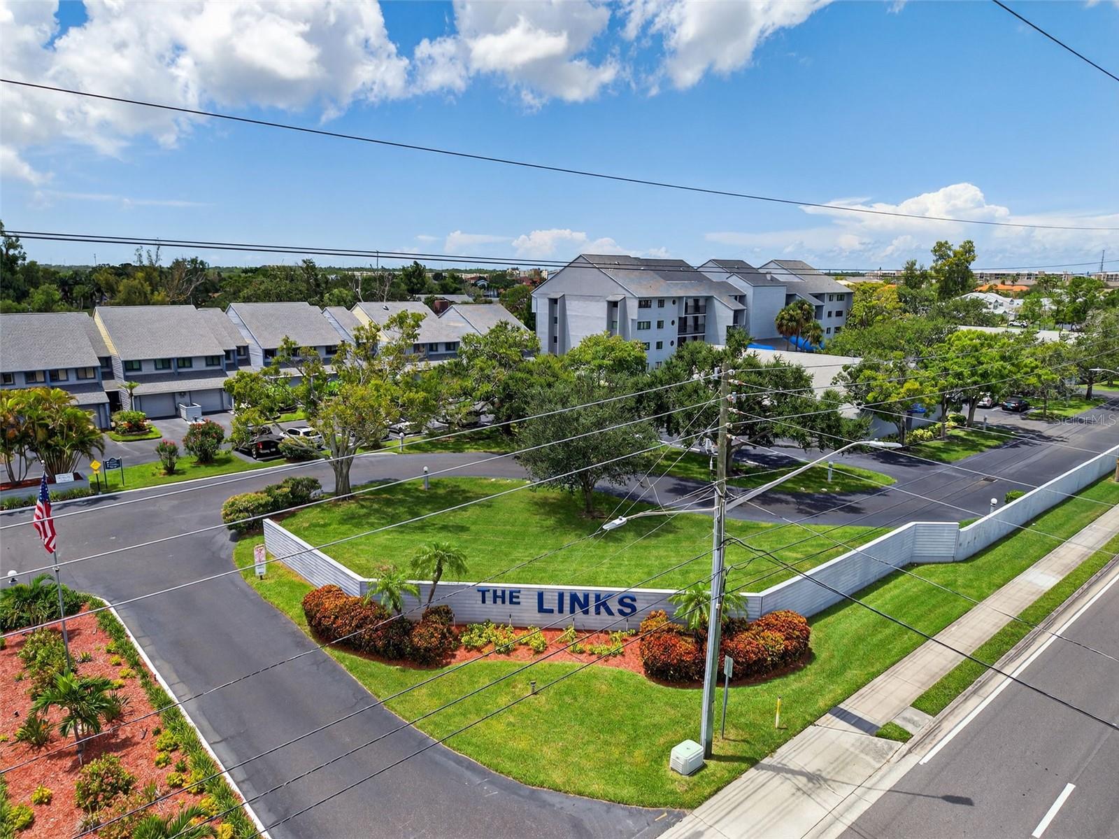 Fantastic 2-bed, 2-full bath, 1400sf, fully updated 2nd floor unit with a 1 car Garage, that fits your car and a lot of storage, at 'The Links Condominiums', right on the 5th hole of Seminole Lakes Country Club, featuring the area's favorite 18 hole golf course and the finest tennis facility around, now on the market for under $400,000! A condo at The Links doesn't come on the market that often, especially units that are in this condition, with this much PRIVACY. The screened in porch is ENORMOUS and very Private! The porch faces south which is exactly what you want, sunny in the Winter and shade in the Summer! 2nd floor ensures that you will always be high and dry and only a short walk up to the unit, if you wish to not use the elevator. A clean and beautifully maintained unit with wonderful upgrades, such as: New HVAC in 2023; new kitchen appliances 2023; new washer & dryer 2023; new electric window-shade for the sliders in 2023; fully painted in 2023. This place is turn-key and tight! The floor plan is wide open with a great UPDATED kitchen for the chefs out there. Tons of closet space in this unit, private Laundry room in the unit, updated master bath and well run HOA! Complex has a community heated pool and hot tub with a nice clean convenient owner clubhouse. The Location of The Links is PRIMO! Close to everything and 10 minutes from the beach, in the heart of Seminole. Close to grocery stores, restaurants, malls, airports, entertainment, hospitals, clinics, downtown St. Pete, golf/tennis, in the heart of Pinellas County. With endless greenspace as your back yard, and having an enormous screened-in porch, W/D in the unit, new AC, turnkey, with a LOW HOA fee of $574/month, this one won't last long. Make sure you take a look at this opportunity before it's gone!