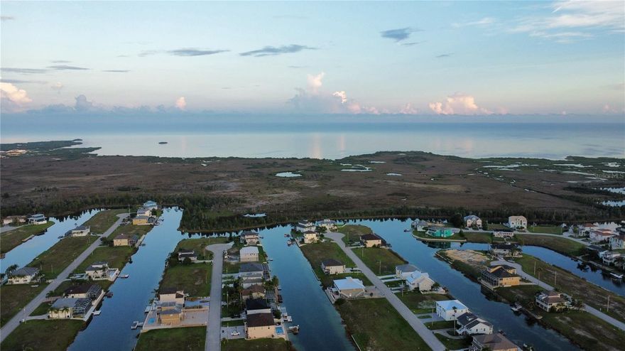 This exquisite waterfront property, located in the Hernando Beach South community, presents an ideal canvas for your waterfront dream home. Embrace the quintessential Florida lifestyle in this serene community, relishing in endless sunsets and discovering the numerous great fishing spots along the Gulf of Mexico. Residents can take advantage of the community's boat lift, providing convenient access to the Gulf of Mexico. The property's proximity to Weeki Wachee Springs, Pine Island, Aripeka, Spring Hill, and various restaurants further enhances its appeal.