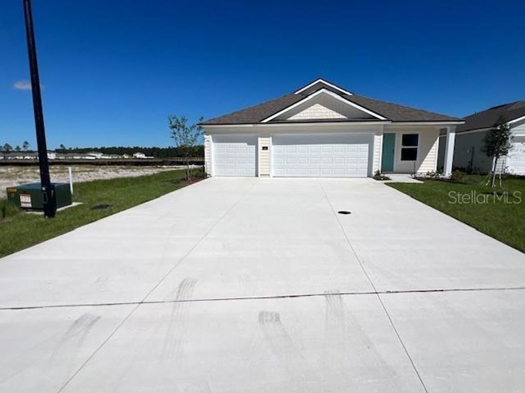 Photo of 46 Sawdust Lane, Palm Coast, FL 32137 (MLS # FC312138)