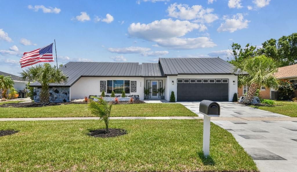 Photo of 325 Gladstone Boulevard, Englewood, FL 34223 (MLS # TB8394010)