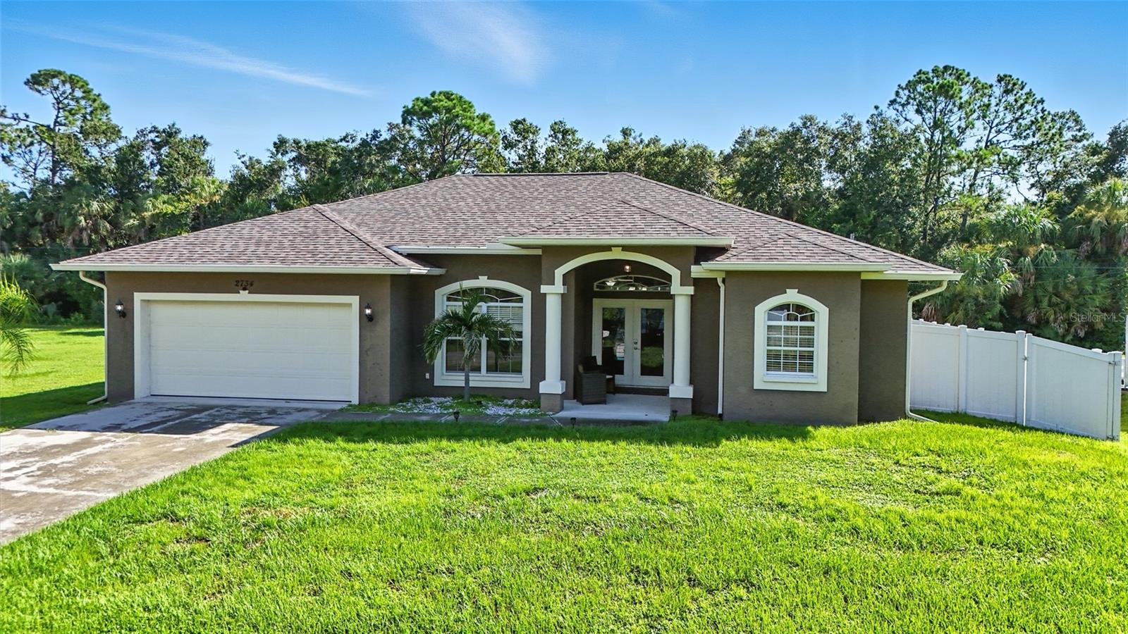 Welcome to this beautifully maintained 3 bedroom, 2 bathroom pool home located in a quiet and convenient neighborhood of North Port, offered TURN-KEY! Situated on a spacious lot this property combines comfort, charm, and recent updates that make it truly move-in ready. Step inside to a warm and inviting sitting area that welcomes you into the home, followed by a generous entryway featuring built-in shelving and a formal dining area that adds both character and functionality. The open-concept floor plan seamlessly connects the kitchen, dining, and living spaces, making entertaining a breeze. The eat-in kitchen boasts a breakfast bar, stainless steel appliances, and a view that opens directly onto the covered lanai and screened-in (caged) pool—perfect for enjoying Florida living year-round. Whether you're relaxing poolside or hosting friends, this large fenced backyard is ready for it all. A brand new pool pump (2025) also ensures worry-free enjoyment for years to come. The primary suite is a private retreat, with sliding glass doors leading directly to the lanai, and an ensuite bathroom featuring custom cabinetry (2023), dual vanities, a large soaking tub with beautiful stone accents, and ample space to unwind. Additional updates include NEW FLOORING in the bedrooms (2023), a new REVERSE OSMOSIS system, and a brand NEW WELL installed in 2025, ensuring reliable water service and efficiency. Situated in a peaceful residential area of North Port, this home offers quick access to shopping centers, restaurants, and the newly developed Wellen Park. You're just a short drive from Gulf Coast beaches, A WATER PARK at North Port Aquatic Center and a variety of parks and outdoor activities, making it the perfect place to enjoy both convenience and nature. Don’t miss this opportunity to own a beautifully upgraded pool home in one of North Port’s most desirable locations!