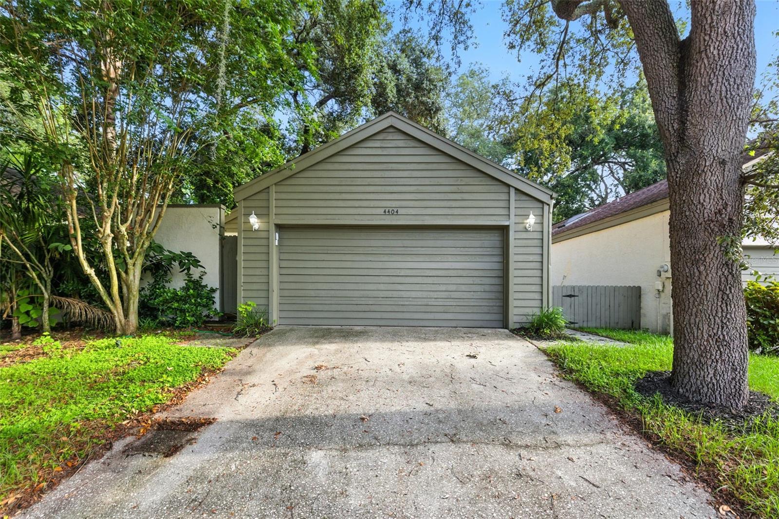 This beautifully maintained 1-story detached condo offers 3 bedrooms, 2 full baths, and 1,389 square feet of comfortable living space—perfectly located just minutes from the University of South Florida, medical district, and local hospitals. Step inside to find a bright and airy floor plan featuring ceramic tile and laminate wood plank flooring throughout for easy maintenance. The updated kitchen is a chef’s delight, showcasing Quartz countertops, solid wood cabinets, stainless steel appliances, and a cozy breakfast nook. Enjoy meals in the formal dining room accented with chair rail molding, or relax in the spacious living room with vaulted ceilings that create an open, inviting feel. The primary bedroom is generously sized, offering a walk-in closet, private ensuite bath, and direct access to the screened lanai. Two additional bedrooms and a full guest bath provide plenty of room for family or visitors. Outdoor living is a breeze with a covered, screened lanai overlooking the fenced backyard, perfect for enjoying Florida’s year-round sunshine. Additional highlights include updated lighting throughout, a spacious laundry room, and an attached 2-car garage for convenience and storage. As part of this welcoming Sweetwater Oaks community, you’ll also have access to a sparkling gated community pool & sun deck. With easy access to I-275, you’re just 30 minutes from Tampa International Airport, and a short drive to dining, shopping malls, grocery stores and entertainment.