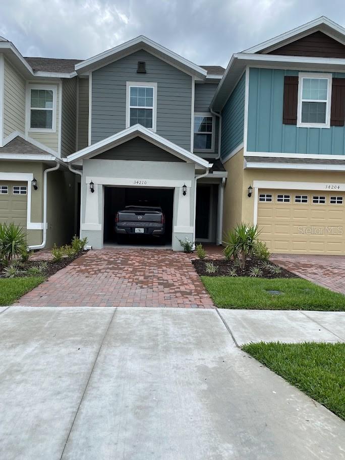 Are you looking for almost a new home absolutely worry free? If yes, how about a Brand new 3 bedroom 2.5 Bath and 1 Car Garage in Wesley Chapel!! Right on 54 next to Home Depot and many key stores and restaurants!! All appliances included and they all are smart appliances and energy efficient!! How about Tesla/EV Charger plug-in already existing in the Garage!! 1st Floor is fully tiled and kitchen has a window for daylight!! Sliding door takes you to the back of the house to enjoy some openness and nature!! Community offers pool and play area!! HOA covers exterior maintenance and pest control - you don't have to mow your lawn!! Community is surrounded by loads of greeneries and nature!! Come and see it for yourself to make this your next home!! Please schedule an appointment as this house is available NOW!!
