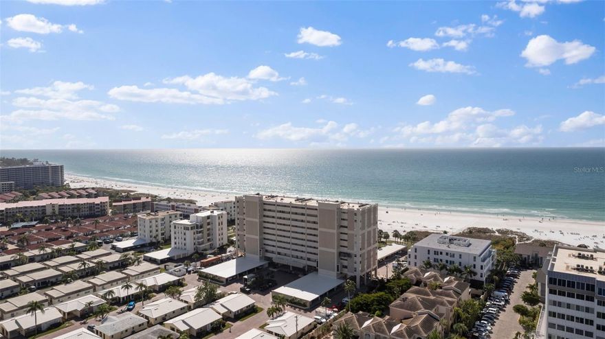 Welcome to Horizon's West, Siesta Key's premier beachfront community, offering breathtaking views of the Gulf of Mexico and stunning sunsets. Step into this fully renovated 8th floor corner unit, where wide-open vistas of the Gulf of Mexico and Crescent Beach greet you.  Professionally decorated, this condominium boasts a chef-inspired kitchen with top of the line appliances, quartz countertops and backsplash,  Signature Hardware main sink, Kohler bar sink, Brizo faucets, along with custom bookcases for added storage.  The condo features the latest LED lighting, including chandeliers, pendant lights, and ceiling fans.  Wake up in the primary bedroom to sensational views, and indulge in the custom closet and ensuite updated bath with custom cabinets, quartz countertops, stand alone tub, tile shower with frameless glass and updated Kohler fixtures.  Bedroom 2 showcases custom cabinets and bookshelves, walk in closet and renovated bath with updated cabinet, quartz countertop,Kohler fixtures, sink and hardware, mirror, and frameless glass shower. Bedroom 3 features custom bookshelves an updated ensuite half bath with quartz countertop, tile backsplash, cabinet, Kohler sink and fixtures.  The laundry room has been tastefully remodeled with custom cabinets, quartz countertops, tile backsplash, Grohe faucet and Houzer sink.  Ease of maintenance with tile floors and freshly painted throughout.  This condominium includes one carport space with a Tesla charging station.  Horizons West provides an array of amenities, including a gulf-side pool, clubhouse, onsite manager, fishing pier and park on the Intracoastal side of the community, and has deeded beach access.  Experience luxury living on Siesta Key with unparalleled beachfront elegance. Siesta Key has world famous beaches with fine quartz sand that has a powdery fine texture and is cool the touch.  Siesta Key village awaits with restaurants and shopping to get together with all of your friends and family.  Please note furnishings are negotiable.  Please refer to realtor remarks for information on negotiable furnishings.