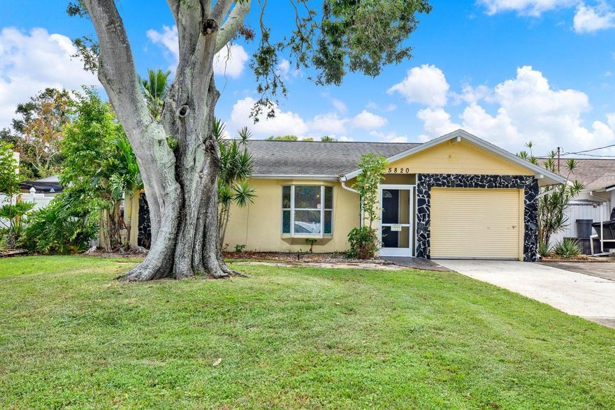 One or more photo(s) has been virtually staged. Welcome to your perfect balance of serenity and convenience in this rare spring-fed lakefront home, tucked away in Pinellas Park yet central to everything Tampa Bay has to offer. Just 15 minutes from vibrant Downtown St. Pete, 18 minutes from Tampa International Airport, and 20 minutes from world-famous Madeira Beach, Treasure Island, and St. Pete Beach, this property is truly at the center of it all. Whether you’re commuting, exploring, or entertaining, the location offers unmatched lifestyle and accessibility.

Imagine waking up to shimmering water views and ending your days with breathtaking sunsets from your private dock. This home lives like a retreat while keeping you close to the action. Step outside to lush landscaping, a cozy fire pit, and sweeping water views that create a peaceful retreat you’ll never want to leave. With two spacious driveways offering parking for up to five vehicles—or even space for your boat—you’ll have more than enough room for both convenience and fun. Embrace true Florida living: swim, kayak, or fish in your own backyard, host friends for lakeside dinners, or simply relax in the tranquility that only a spring-fed lake can provide.

Inside, the open-concept living spaces flow seamlessly to a screened over sized patio overlooking lush greenspace and the sparkling lake, creating the ideal backdrop for morning coffee, family gatherings, or weekend entertaining. With three bedrooms, two bathrooms, plus a versatile bonus room featuring a built-in Murphy bed, this home adapts easily to your lifestyle—whether you need a home office, guest suite, or creative studio. The primary suite with en-suite bath opens directly to the patio, blending indoor comfort with outdoor beauty.

With a newer roof (2019), HVAC (2021), water softener (2024), washer and dryer (2022), irrigation system, and NO FLOOD INSURANCE REQIRED, peace of mind comes standard. This is more than a home—it’s a lifestyle. A rare lakefront escape in the most convenient location Pinellas has to offer. Don’t wait—schedule your private showing today and experience what makes this property one of a kind!