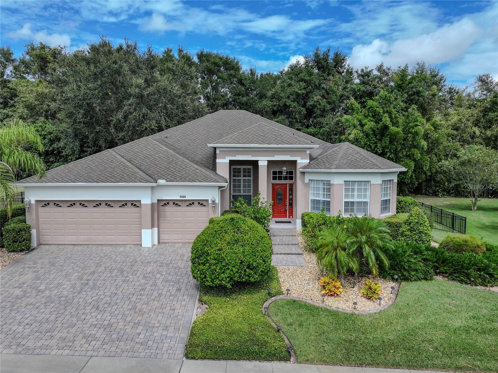 WELCOME HOME TO THE ESTATES OF TREMAYNE! DISCOVER THIS 4-BEDROOM 3-FULL BATHROOM HOME IN THE DESIRABLE STONEYBROOK HILLS COMMUNITY OF MOUNT DORA. FEATURING A THOUGHTFULLY DESIGNED SPLIT FLOOR PLAN, THIS RESIDENCE OFFERS BOTH COMFORT AND STYLE. ENJOY COZY EVENINGS BY THE BUILT IN ELECTRIC FIREPLACE. OR IF YOU WISH, YOU CAN CURL UP ON THE COUCH TO WATCH A MOVIE WHERE THE SURROUND SYSTEM ENHANCES YOUR ENTERTAINMENT EXPERIENCE. THE SPACIOUS WELL APPOINTED PRIMARY SUITE OFFERS A SEPARATE SITTING AREA, SLIDERS TO THE LANAI, AND LUXURIOUS HIS-AND-HERS WALK IN CLOSETS. THE EN-SUITE BATHROOM IS A TRUE RETREAT, COMPLETE WITH A JETTED TUB FOR ULTIMATE RELAXATION, AND HIS AND HERS GRANITE DOUBLE SINK VANITY. THE KITCHEN FEATURES A BUILT IN OVEN, A SLEEK GLASS COOKTOP, STAINLESS STEEL APPLIANCES, AND GRANITE COUNTERTOPS. THE COMMUNITY IS WELL-LIT WITH SIDEWALKS THROUGHOUT, PROVIDING A WELCOMING ENVIRONMENT. RESIDING IN STONEYBROOK HILLS MEANS ACCESS TO EXCEPTIONAL COMMUNITY AMENITIES, INCLUDING A CLUBHOUSE, SWIMMING POOL, TENNIS COURTS, BASEBALL FIELD AND A PLAYGROUND, JUST TO NAME A FEW. THIS HOME IS LOCATED CLOSE TO DOWNTOWN MOUNT DORA WHERE YOU CAN ENJOY MANY FESTIVALS, RESTAURANTS, AND SHOPS. DO NOT MISS YOUR CHANCE TO EXPERIENCE THE PERFECT BLEND OF ELEGANCE AND CONVENIENCE IN THIS EXCEPTIONAL PROPERTY.