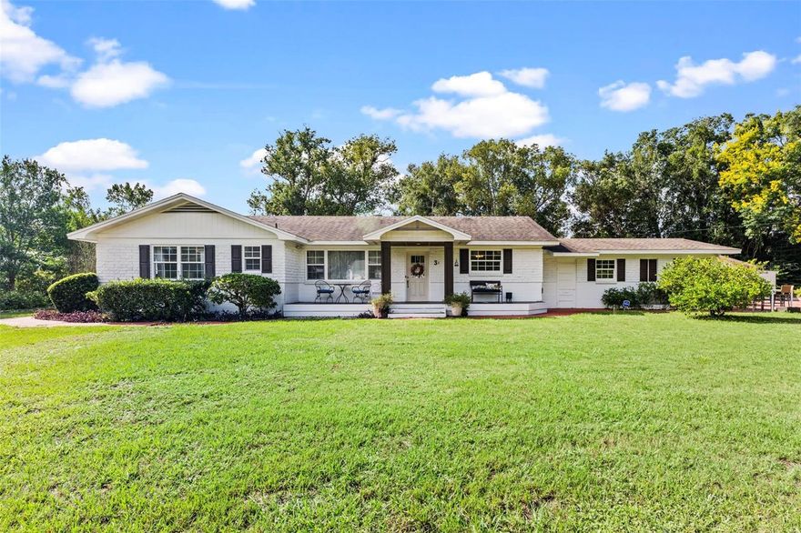 Welcome to this thoughtfully designed 3-bedroom, 3-bathroom single-level home featuring a versatile in-law suite! Step inside to an inviting open layout where the living room flows seamlessly into the dining area and spacious family room. Enjoy beautiful wood floors, large floor-to-ceiling windows, and skylights that fill the home with natural light.

The primary suite, privately located at the back of the home, offers two full bathrooms and a generous walk-in closet—creating a true retreat. Down the hallway, you’ll find two comfortable guest bedrooms and a full bath with a stand-alone shower.

The kitchen is bright and functional, featuring stainless steel appliances, tile countertops, and charming glass-front cabinetry. An added highlight is the in-law living area, complete with its own bedroom, living space, and kitchen—ideal for guests, multi-generational living, or extended stays.

Outside, enjoy relaxing on the welcoming front porch or the spacious back patio surrounded by mature landscaping.

Conveniently located near top-rated schools, parks, award-winning Downtown DeLand, Stetson University, shopping, dining, and medical facilities—with easy access to the beaches and Orlando.

This home offers flexibility, comfort, and a prime location—all on one level!