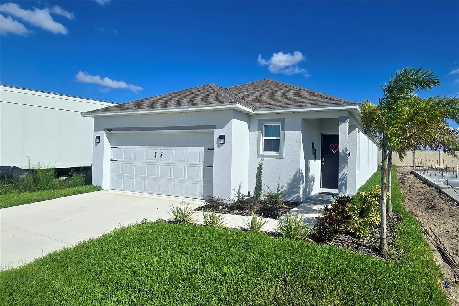 Welcome to 5539 MADDIE DR, a beautifully maintained newer 3 bedroom home located in Haines City, Florida. This charming home offers the perfect combination of modern comfort and convenience, making it ideal for first time home buyers, or those looking to settle in Central Florida. The open floor plan features spacious living areas, perfect for both relaxing and entertaining. The kitchen is equipped with stainless steel appliances, ample cabinet space, and a breakfast bar for casual dining. The primary suite provides a peaceful retreat with an en-suite bathroom and a walk-in closet, offering both privacy and comfort. This community offers 2 dog parks, and an amazing community pool for those hot summer days! The home's location is one of its greatest assets. Situated in the peaceful new HAMMOCK RESERVE community, it offers a nice balance of tranquility and accessibility. Just 25 minutes away, you can enjoy all the magic of Walt Disney World, while Universal Studios Orlando is a short 35-minute drive, bringing thrilling rides and attractions right to your doorstep. SeaWorld Orlando is another nearby option, located just 30 minutes from the property, while Legoland Florida, only 20 minutes away, offers a fun experience with interactive attractions. In addition to its proximity to world-famous theme parks, this home is ideally situated for easy access to both Orlando and Tampa. With I-4 just a short drive away, you can reach Tampa's vibrant downtown area, along with attractions such as Busch Gardens and the Florida Aquarium, in about 45 minutes. Whether you're looking for a starter home, a snow birds haven, or an investment property, 5539 Maddie Dr, offers tremendous value. Its strategic location, close to major Central Florida attractions and easy access to both Orlando and Tampa, makes it an attractive option for those seeking a comfortable and convenient Florida lifestyle. Don't miss your opportunity to own a piece of Central Florida paradise and the best thing is it is brand new, fully equipped, ready to move in today.FINANCING AVAILABLE.