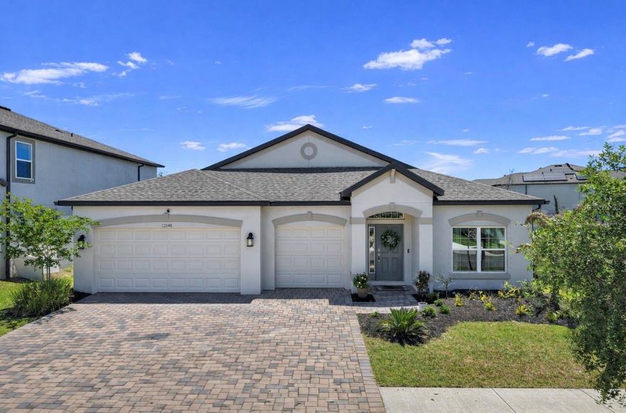 Welcome home to this BEAUTIFUL 4 bedroom, 3 bath home with 3-car garage situated on a PREMIUM CORNER LOT and zoned for "A-RATED" SCHOOLS!  From the moment you arrive, you’ll appreciate the EXCEPTIONAL CURB APPEAL featuring fresh landscaping and an attractive paver driveway.  This home offers added privacy and open views with a large field area beside the property and serene pond views in the rear.  As you make your way inside, you'll notice NATURAL LIGHT floods the interior and glistens off the grey-hued LVP wood-look flooring.  The expansive great room offers tons of space for both relaxing and entertaining, flowing seamlessly into the kitchen and breakfast nook to create the perfect OPEN-CONCEPT layout. The chef's kitchen features stylish GREY CABINETRY, Granite counters, stainless steel appliances including a BUILT-IN OVEN and MICROWAVE, a COOKTOP HOOD, closet pantry, designer pendant lighting and dining fixtures, and a sleek white backsplash.  The thoughtfully designed split-bedroom floor plan provides both comfort and privacy. Two secondary bedrooms and a full bath are situated at the front of the home, while an additional bedroom and full bath are tucked just off the great room—ideal for guests or a home office. The SPACIOUS PRIMARY SUITE is privately located at the back of the home and showcases a tray ceiling, a massive walk-in closet, and a luxurious ensuite bath complete with dual vanities, a soaking tub, tiled walk-in shower, and private commode.  Step outside to the SCREENED-IN LANAI overlooking the massive backyard and TRANQUIL POND VIEWS, creating the perfect setting to enjoy Florida living year-round.  Located in the desirable neighborhood of Cedarbrook, residents are granted access to resort-style pool and amenities.  Schedule your showing today!