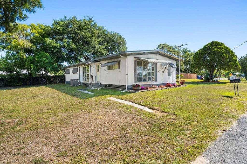 Photo of 10220 Wellington Avenue, Dade City, FL 33525 (MLS # W7885127)