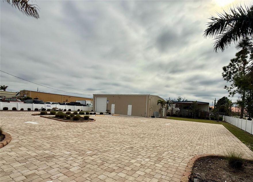AMAZING OPPORTUNITY to own a prime 2,246 sq. ft. commercial warehouse zoned HC (Highway Corridor) at 121 E Mckenzie St, Punta Gorda, FL 33950. This gem is nestled just 0.5 miles from bustling Downtown Punta Gorda and a mere stone's throw from US Highway 41, making it an ideal spot for any business looking to thrive in a vibrant commercial zone. Situated right behind the Dollar General on McKenzie St, this property not only enjoys high visibility but also benefits from the heavy traffic flow of this busy commercial corridor. The warehouse sits on a generous 10,801 sq. ft. lot, offering space for expansion or additional parking. The building itself features two potential office spaces and a handicap-modified bathroom, ensuring accessibility and functionality. Completely transformed in 2021, this property now boasts new pavers enhancing the exterior aesthetic, fresh landscaping for an inviting look, a new front gate for security and privacy, interior spray foaming for energy efficiency, split A/C systems for comfort in every corner, and a new roof on the main part of the building for durability and peace of mind. Enjoy the convenience of being surrounded by a plethora of restaurants, businesses, and services right off Hwy 41, making this location not just a workplace but a hub of activity. There's also the opportunity to purchase the property directly across the street, listed separately, for those looking to expand their commercial footprint. This is your chance to own a piece of prime real estate in one of Punta Gorda's most sought-after commercial areas. Don't miss out on making this your next venture's home base. Bring all offers!