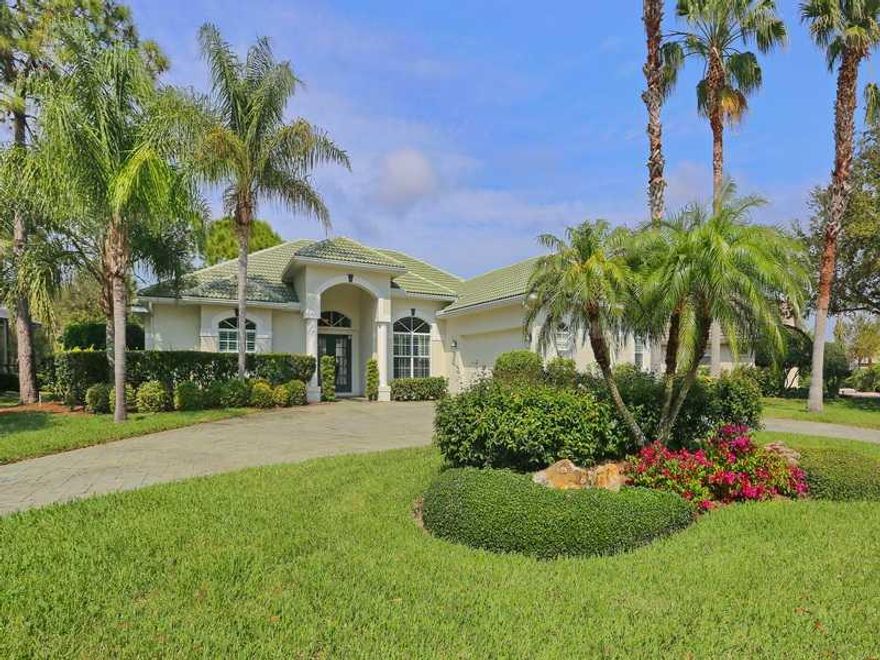 YOU WILL KNOW THIS IS A VERY SPECIAL COMMUNITY WHEN YOU ENTER CALUSA LAKES. With it's 2 large waterfalls,  winding streets, large trees and mature landscaping. Pride of ownership shows in this 3 bedroom, 2.5 bath home. Spacious open floor plan. Pocket sliding glass doors in the great room with wide vista views of the lake and golf course. Formal dining room. Kitchen features raised panel step cabinets with crown molding on top, planning desk and wine rack. Large aquarium window in morning room. Owner hascustomized this floor plan so the 3rd bedroom can also be used as an office. This bedroom/office has the 1/2 bath that also opens to the pool. Master bedroom has sitting area and 2 walk-in closets. Master bath features two vanities, dressing table, Romanshower and private commode area. Stamp-Crete design on large lanai and pool deck. Outside kitchen with sink and refrigerator. The heated pool & spa has a wonderful private lake and golf course view. Over sized side load 2 car garage with storage cabinetsand work bench. Stamp-Crete design on circular drive way. Calusa Lakes is a semi-private golf course community. You do not have to join to play golf or enjoy the club house. Great location close to beaches, shopping, churches, great restaurants and the Legacy bike and hiking trail. ALL FURNITURE IS AVAILABLE FOR EXTRA $$