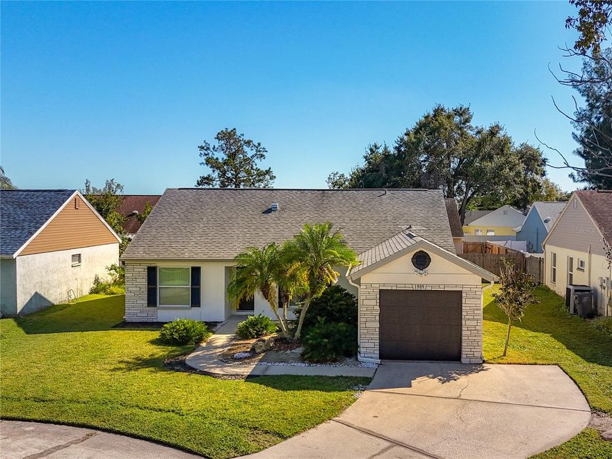 --WONT LAST LONG---Discover this immaculate 3-bedroom, 2-bath home with garage located on a quiet cul-de-sac in the heart of Oldsmar. Featuring spacious living areas with vaulted ceilings, a primary bedroom with an ensuite, and a split bedroom layout for added privacy, this modern residence includes high gloss tile throughout the home and a rear screened porch perfect for relaxing or entertaining. , the home has been thoughtfully upgraded with a new electrical panel (2018), roof (2020), air conditioning system (2021), gutters (2022), garage door (2022), water heater (2022), and water softener tank (2024) Exterior Water Line (2025). along with fresh exterior paint. Situated just steps from Sheffield Park, residents enjoy access to hiking and running trails, tennis and basketball courts, a playground, and a covered pavilion for events. Conveniently close to shopping centers, restaurants, downtown Tampa, the international airport, Clearwater beaches, and St. Pete, this neighborhood offers a peaceful environment without HOA fees, with no history of hurricane damage or flooding. ($398k furnished price) This turnkey home combines modern comfort with an unbeatable location—great curb appeal, stop by and take a look you wont be disappointed!