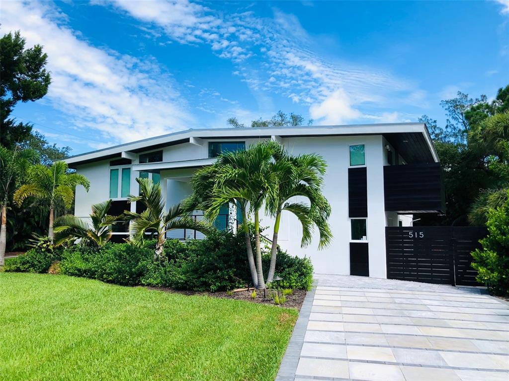 Be sure to seize this rare opportunity to call this turnkey, designer, brand-new fully-furnished coastal-chic Siesta Key home your very own. Featured in 2022 in Ocean Home Magazine, Sarasota Magazine, House Beautiful and Real Homes, this one-of-a-kind gem blends contemporary European design with a touch of Florida at every turn. The home underwent a full-interior design makeover in 2022 to compliment the complete 2019 structural renovation which was done with the highest standards of detailed craftsmanship. Rooted in the highest of environmental standards for a healthy home, the wood flooring by Lauzon Pure Genius Air Purifying Smart Floors creates a rich, beautiful aesthetic that also optimizes indoor air quality. The vast number of windows and sliding doors on the first level ensure you enjoy views of the lush Florida landscaping. The grand entrance, with the awe-inspiring chandelier, invites you to continue to the spacious open-plan living area. The gourmet kitchen, designed for functionality, comfort, and entertaining, features top-of-the-line Miele appliances, Brazilian granite countertops with waterfall edges, Harmoni cabinetry, a 6-foot Galley workstation and Eurowall windows for optimized indoor/outdoor entertaining. The commercial grade designer counter stools offer plenty of seating around the kitchen island and peninsula. The eye-catching dining room lighting centers the beautiful dining area which is perfect for parties and gatherings. The family room is outfitted with comfortable, luxurious furnishings including a plush u-shaped sofa that is stain resistant. The bedrooms are all equipped with designer ceiling fans and lighting as well as brand new furnishings that give each room its unique character. The upstairs loft area offers multi-functionality as a lounge/workspace and is equipped with a commercial-grade trundle sofa to accommodate additional guests. The bathrooms feature marble throughout, from floor to ceiling, with luxurious hardware and finishes and digitized smart shower systems. Stepping out into the tropical atmosphere of the backyard, you are invited to enjoy a dip in the sparkling, saltwater swimming pool, complete with a spa and surrounded by a deck of quartzite pavers with separate bar and grill area for entertaining. The detached 2 car garage provides plenty of storage and can easily be converted into extra living area. Other environmental features include a smart irrigation system to keep your landscaping green and lush. The home was featured in numerous media articles for “best of 2022 home trends” for its gorgeous sustainable interior design which optimizes the best in luxurious eco-friendly and ethical furniture and décor as well as its outstanding construction. The home feels brand new as the 2019 structural renovation project produced new electrical, new plumbing, a new roof and so much more. The 2022 interior design project carefully curated the best in eco-chic, nontoxic furnishings. This spectacular home will make you feel as though you are living in a dream worthy, secluded island paradise with the accessibility of being just minutes away from the eclectic, restaurant and shop-filled Siesta Key Village and the crystal blue water and powdery white sand of Siesta Key beach. The best of both worlds wrapped up in this one-of-a-kind, amazing home.