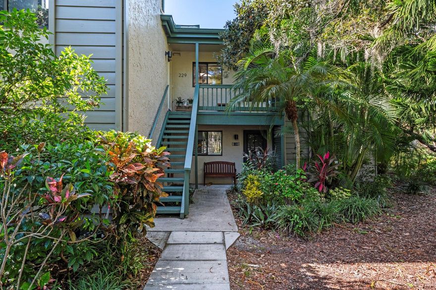 Experience the epitome of coastal living in the exclusive gated Pelican Cove Community. Revel in the natural light that pours in through the clerestory windows and expansive sliding glass doors, illuminating the impeccable craftsmanship within. The remodeled kitchen boasts tile floors, striking quartz countertops, and wood cabinets complemented by top-of-the-line stainless steel appliances.  Modern conveniences abound, including a newer A/C system, recessed lighting, upgraded electric panel, and refreshed bathrooms with stylish quartz vanities, glass enclosed showers and tubs.  Unwind on your glass-enclosed lanai as you immerse yourself in nature's splendor. Spread across 75 acres of pristine, gated waterfront property, Pelican Cove is a tropical oasis teeming with amenities. Discover an 86-slip boat harbor, six heated swimming pools, a hot tub, three clubhouses, lighted tennis and pickleball courts, shuffleboard, basketball, dog walking areas, and over 5 miles of walking trails and boardwalks. Unleash your creativity with art studios, a pottery classroom, woodworking, and sculpting, or attend classes at Pelican Cove University. Choose from over 37 clubs, including photography, fiber art, biking, yoga, Tai Chi, culinary arts, and card clubs. The community also offers evening jazz and classical music concerts, ensuring an enriched lifestyle for all. Award-winning landscaping and superior management set Pelican Cove apart as the ultimate adult sanctuary. Just minutes from Siesta Key Beach, fine dining, and shopping, this stunning condo is your ticket to a life of luxury and leisure by the bay.