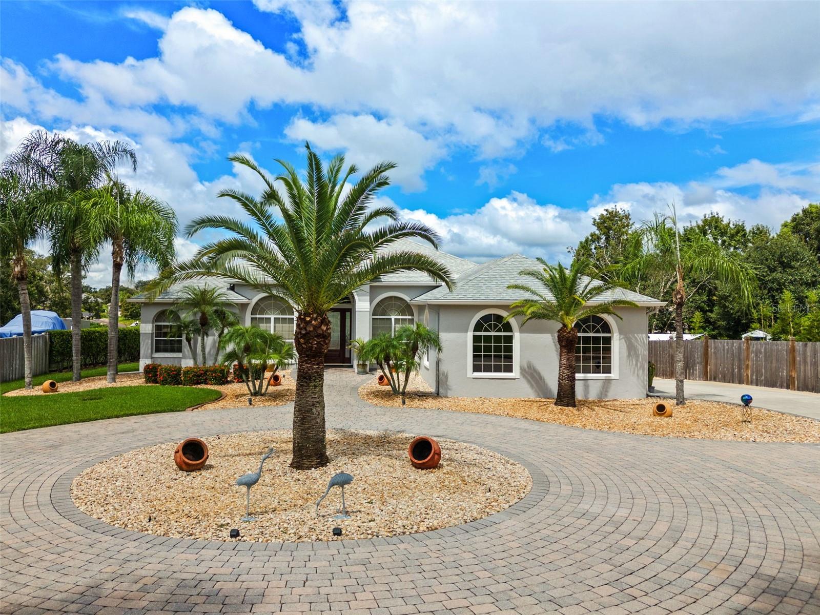 Welcome to your private lakefront oasis at 10925 Lakeshore Dr! This beautifully updated 3-bedroom, 2-bathroom pool home is perfectly situated on Crescent Lake, offering direct access to the renowned Clermont chain of lakes. The property spans a generous .83 acres, providing ample space for outdoor enjoyment, including a 22x12 detached garage. Step inside to find a home that has been meticulously cared for, with recent updates including a new roof in 2016 and a new AC in 2022. The wi-fi enabled thermostat and a new garage door opener add to the home's modern convenience.
The heart of the home, the kitchen, boasts new appliances, ready for your culinary adventures. Many of the doorways are 8 feet tall, adding to the spacious feel of the home. Fresh interior and exterior paint give the home a bright and inviting feel. Outside, the screened-in pool and spa have been recently resurfaced with a new pump, creating a perfect retreat for relaxation or entertaining. A buried 250-gallon propane tank fuels the pool/spa heater, fireplace, cooktop, and water heater, while the pool deck is plumbed with a gas line for a grill. The private dock and boat house feature a new boat lift motor and cables, making lake access a breeze.
With over 2000 square feet of air-conditioned living space and an incredible outdoor living area featuring roll-down sunshades, this home offers the ideal blend of comfort and lakeside leisure. The garage has epoxy flooring, providing a clean and durable surface. This is a rare opportunity to own a piece of paradise on the Clermont chain of lakes.