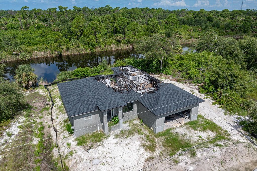 Photo of 10303 Redondo Street, Port Charlotte, FL 33981 (MLS # C7513185)