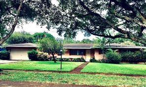 Highly desirable spacious home in beautiful Plantation Gardens. Home sits on over 1/3 acre with 30x15 in-ground pool and large deck. Living areas and master bedroom look onto pool with walls of glass and sliding doors. There are 4 bedrooms and 4 full baths. Features 2 large walk in cedar closets, terrazzo floors and a full length 3rd driveway providing parking for 7 cars including a pad behind the fence perfect for car or boat storage. There are 2 work/storage rooms within the 2 car garage. Two master suites. The main/master overlooks the pool with multiple glass/sliding doors, separate a/c, 3 closets, 2 walk in (1 fully cedar lined) . Spacious master bath with garden tub, dual sinks and lots of counter space and storage. New A/C 2021. New roof over master 8/2025. Termite bond.