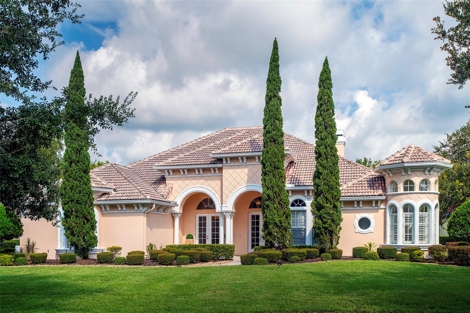 Lakefront living in the premier Seminole County community of Lake Forest. Executive home with three bedrooms, office, 3.5 bathrooms and 3 car side-entry garage. Elegant black granite floors, wood floors, butler’s pantry/wine bar, custom built-ins and plantation shutters. Primary bedroom is a true retreat with double door entry, large custom walk-in closet and secondary walk-in closet plus built-in cabinetry serving as a coffee/beverage bar with fridge and numerous storage drawers and cabinets. Primary bathroom includes walk-in shower, circular tub, two vanities, large linen closet and private water closet. Generous sized secondary bedrooms are on the other side of the home, with French doors to separate from the rest of the house and one room having private access to the patio. All bedrooms have new carpet. Kitchen with walk-in pantry, breakfast bar and center island. Enjoy scenic views of the lake from the indoor/outdoor entertaining space with corner sliders, covered lanai complete with wood burning fireplace and a gorgeous saltwater pool with multiple waterfalls. Two additional wood burning fireplaces located in family room and formal living room. Lake Forest offers a 24-hr guard-gated entry with resort style amenities: 10,000 sq ft clubhouse w/ newly remodeled fitness center, Jr. Olympic-sized swimming pool, heated spa, kiddie pool, playground, 55-acre private spring-fed lake, fishing pier, new lighted tennis and pickleball courts & a sports court. The community has been designated as a National Wildlife Habitat. Lake Forest is zoned for Seminole County schools and is close to beaches, attractions and all that Central Florida has to offer! Easy access to I-4, 417 and 429.