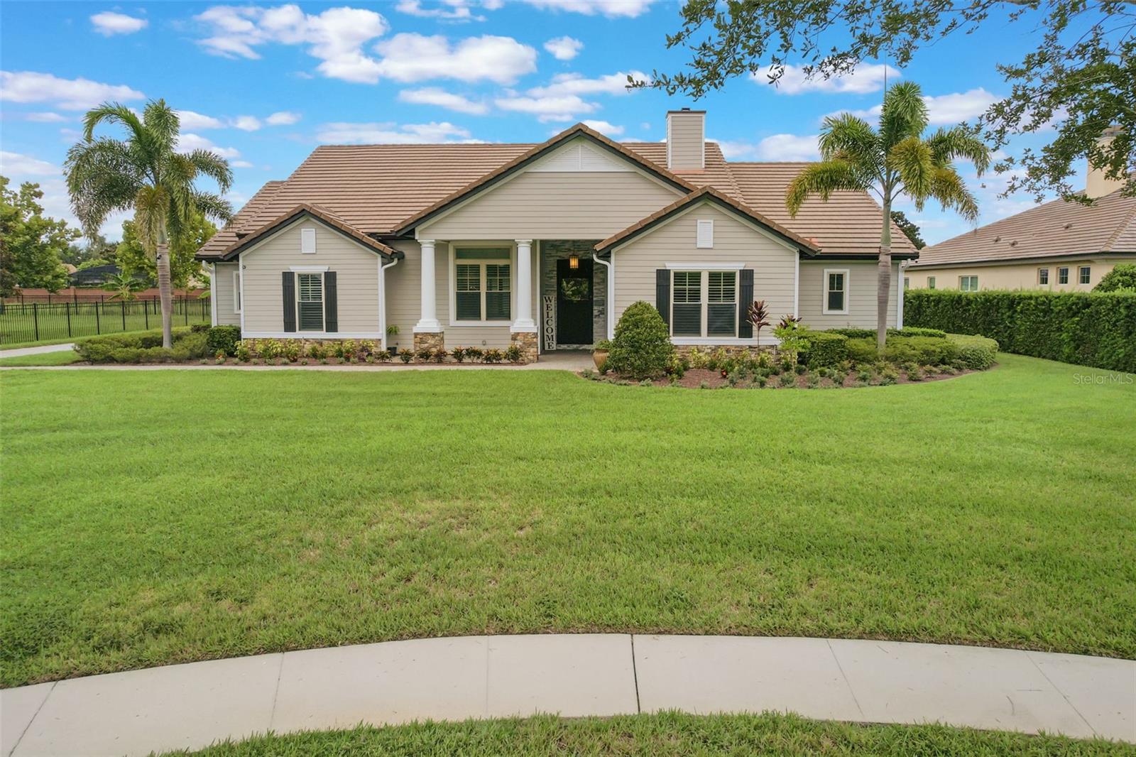 One or more photo(s) has been virtually staged. Experience luxury Florida living at its finest in this stunning one-story custom home, perfectly situated on nearly an acre in the sought-after Lake Cypress Cove community of Windermere. With approximately 3,000 square feet of beautifully designed living space, this 4-bedroom, 3-bathroom split floor plan offers both privacy and an open, inviting flow ideal for everyday living and entertaining. From the moment you step inside, you’re greeted by a grand 12-foot ceiling great room accented with striking Cypress wood beams, creating an immediate sense of warmth and sophistication. The gourmet kitchen is a chef’s dream, featuring premium finishes, ample counter space, and a seamless connection to the dining area and main living spaces, making it perfect for hosting family and friends.
A private home office provides a quiet and productive space, while the expansive 3-car oversized garage offers built-in cabinets, a dedicated workshop area, and ample storage. The home is equipped with a high-quality reverse osmosis water treatment system for pure, great-tasting water throughout. Step outside to your personal oasis where a resort-style pool and spa await, complemented by a luxurious covered cabana with a fireplace and mounted TV—perfect for outdoor entertaining year-round. The nearly one-acre lot provides privacy and plenty of space to relax, all enhanced by lush tropical landscaping.
This meticulously maintained residence blends upscale finishes with thoughtful upgrades, and tenants will appreciate the added value of included services: lawn care, pool service, security monitoring, and high-speed internet are all part of the rental, ensuring a worry-free living experience.
The location is just as impressive as the home itself. Situated in a peaceful, upscale neighborhood, you’ll enjoy access to A-rated schools and the added benefit of being just minutes from the highly regarded Windermere Preparatory School—renowned for its academic excellence and strong community. With convenient access to fine dining, boutique shopping, golf courses, and the charm of Windermere’s lakes, this home offers the perfect blend of luxury, space, and location in one of Central Florida’s most sought-after areas.