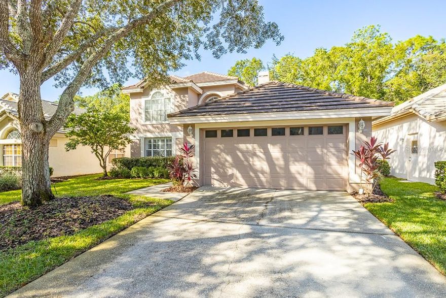 Welcome to your beautifully UPDATED home in the desirable Hunter's Green community! NO CDD! This stunning 3-bedroom, 2 and a half bathroom home offers the perfect blend of modern upgrades, indoor-outdoor living, and an unbeatable location. Step inside and be greeted by high ceilings, natural light, and a comfortable floor plan. The upgraded kitchen features new LG appliances, new hardware, and new ENGINEERED HARDWOOD throughout. Enjoy the striking SHIPLAP decorative fireplace—perfect for cozy evenings and stylish entertaining. Relax or entertain year-round in the screened-in porch overlooking your lush landscaped backyard with NATURAL PRESERVE behind it. Major updates include: UPDATED office, bathrooms, SOFTENER SYSTEM, oversized baseboards, front landscaping, plantation shutters, Electric Vehicle Charger, and NEW fixtures from CRATE & BARREL. ALL bathrooms have been RENOVATED and updated with elegant finishes. ROOF 2016 and AC 2020. Location is key—Hunter's Green amenities include a golf course, park, athletic fields, tennis courts, basketball courts, pool, gym, and playground. Take your BIKES to the nearby Flatwoods Conservation Park, and you are within 9 miles to Wiregrass Mall and Tampa Premium Outlet. Here you will be moments from great schools, dining, shopping, and you'll have convenient access to I-75, I-275, making it easy for commuting. This home is truly a MUST-SEE. Schedule your private showing today.