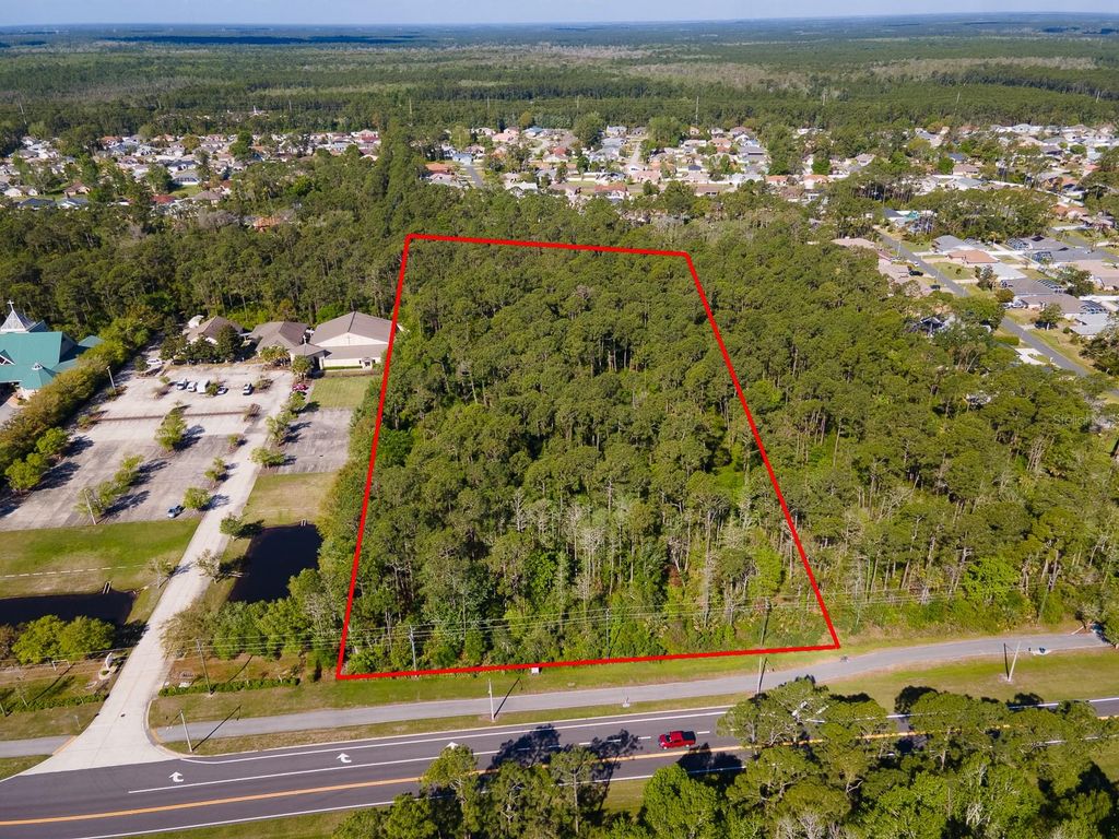 Photo of Xxxx Pine Lakes Parkway, Palm Coast, FL 32164 (MLS # FC318643)