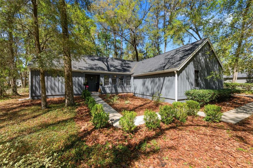 Charming 3-bedroom, 2-bath home in the Laurel Park neighborhood of Haile Plantation! This updated home features a remodeled kitchen with granite countertops, bar with wine fridge, luxury vinyl plank flooring throughout main living areas and bedrooms, and beautifully renovated bathrooms. Enjoy the enclosed back porch overlooking a deck and patio—perfect for outdoor living. Major updates include a new roof, new AC, tankless hot water heater, and fresh exterior paint. Just minutes from Haile Village Center, restaurants, shops, and a nearby park with playground.