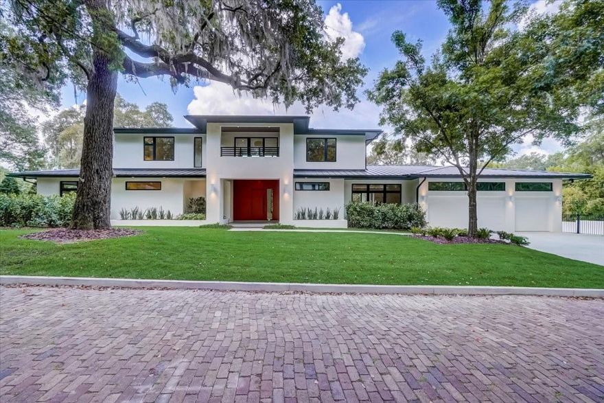 New Construction Custom Built Masterpiece located in one of Winter Park’s most desirable neighborhoods, zoned for top-rated schools in the county and only minutes away from amazing shopping and dining on Park Avenue and East End Market. This contemporary home built by Wooten Built, Inc, Parade of Homes winner in 2020, offers 5,475 SF of luxurious living space. The thoughtfully designed interior features a spectacular open concept floorplan with volume ceilings and oversized picture windows allowing an abundance of natural light. The gourmet kitchen is a chef 's dream with a Patagonia granite island countertop with elegant backlighting. The top-of-the-line Sub-Zero and Wolf appliances, including the Sub-Zero tower refrigerator and freezer, a Sub-Zero wine refrigerator, and a Wolf 5 burner gas grill top, ensure an exceptional cooking experience. The owner’s retreat on the first floor is spacious and showcases a spa-inspired bathroom with a frameless glass walk-in shower, a modern bathtub, and a double vessel vanity. Four additional ensuite bedrooms with custom walk-in closets and designer touches adorn the home. Lutron lighting and shading system set up allows for effortless control of your ambiance. Step out onto your personal outdoor oasis with a relaxing saltwater pool, an extended patio and summer kitchen. This home also features a laundry room upstairs and downstairs,  a three-car garage with an air-conditioned utility and storage room, and a whole house water filtration system. Don't miss the opportunity to own this exceptional luxury home that seamlessly blends elegance, comfort, and functionality. Contact us today to schedule a private showing and experience the epitome of fine living!