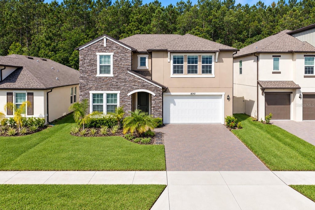Photo of 18342 Serene Lake Loop, Lutz, FL 33548 (MLS # TB8548693)