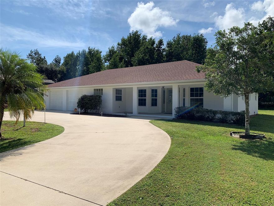 This thoughtfully constructed two bedroom three bathroom home features two master bedrooms, a home office, a large open living room, and a wood burning fireplace. Located on a quite street in the Florida Shores subdivision with no immediate rear neighbors, you'll certainly enjoy the over-sized lot from the front porch or rear patio. The open floor plan with such a large living room is light and bright due to ample windows and is sure to make entertaining a breeze. The kitchen features extensive wood cabinetry with an abundance of room for storage. The over-sized garage two car garage offers plenty of room for parking and storage with an additional climate controlled storage room or office accessible through the garage. The home also has a concrete block detached shed for additional storage and an expansive circular driveway. The home is move in ready and has recently been painted on the interior and had brand new carpet installed. A must see property. ;Water: City