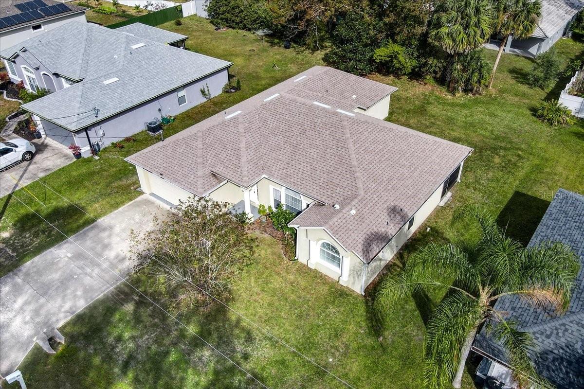 Welcome to this beautifully appointed 4 bedroom, 2-bathroom custom home, ideally located in the center of town, just 10 minutes from Flagler Beach and close to shopping, dining, and all the amenities you need. Situated on a peaceful street, this concrete block home features a range of thoughtful upgrades and design details, ensuring both comfort and style.
As you enter, you're greeted by an open, airy floor plan that highlights the home's architectural charm, including decorative plant shelves, niches, and high ceilings that create a sense of space and light. The home has tiled and wood floors, offering a low-maintenance, modern aesthetic without any carpet. The spacious living room and dining areas flow seamlessly into each other, providing ample space for family gatherings and entertaining guests.
The split floor plan offers a private master suite, featuring a large walk-in closet and a luxurious en-suite bathroom. The master bath is a true retreat, with dual sinks, a deep garden soaking tub, and an expansive walk-in shower. Whether you’re relaxing after a long day or preparing for the day ahead, this bathroom offers everything you need for a spa-like experience.
The upgraded kitchen is a chef's dream, featuring stunning granite countertops, modern cabinetry, and a spacious island that overlooks the family room. This setup is perfect for entertaining, whether you're cooking a casual meal or hosting a dinner party. The kitchen also includes plenty of cabinet space for storage and a full suite of stainless steel appliances.
The three additional bedrooms are generously sized and offer ample closet space, making them ideal for family, guests, or a home office. The second bathroom is also beautifully updated, featuring a tiled shower and modern fixtures.
Step outside to the 10x20 screened-in patio, where you can enjoy the Florida weather year-round. Perfect for outdoor dining, entertaining, or simply relaxing, this patio can be accessed from the family room, living room, and the master suite, making it a convenient extension of your living space.
The home also offers a large 2-car garage with a freshly painted floor, providing plenty of room for vehicles, storage, or a workshop. The inside laundry room comes with extra storage, making everyday tasks more convenient. Blinds and window treatments throughout the home are included, adding to its move-in readiness.
Recent updates include a new roof (2020) and a new AC unit (2022), offering peace of mind for years to come. The home also has gutters, ensuring protection from the elements. With no HOA and the option for short-term rentals, this property offers flexibility and freedom, whether you're looking for a primary residence or a vacation home.
Ready for a quick close, this home is truly turnkey and perfect for anyone looking to enjoy the Florida lifestyle. Don't miss out on the opportunity to make this stunning property your new home!