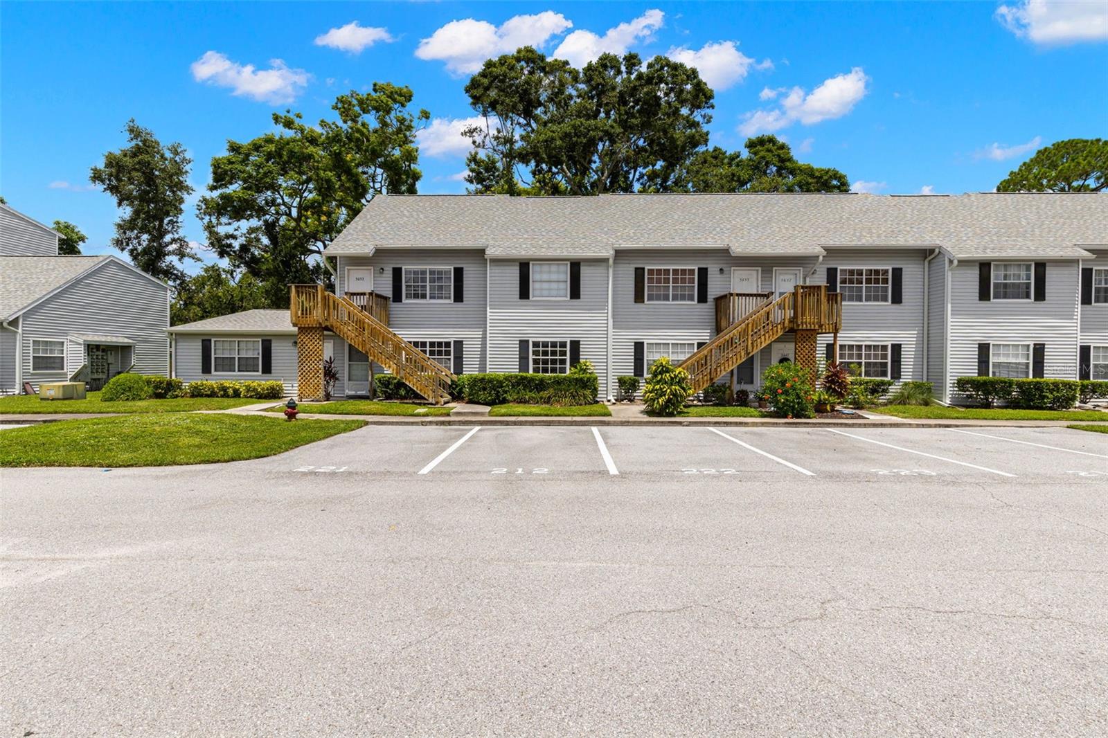 Furnished 2-bedroom, 1-bath condo with 872 sq ft, located on the second floor in a quiet, desirable community. This home features a renovated kitchen with solid wood, soft-close cabinets, updated countertops, and newer appliances including refrigerator, dishwasher, and microwave. The bathroom offers a brand-new vanity, sink top, and fixtures. The floor plan includes a primary bedroom plus a loft-style second bedroom with ample storage, perfect for an office or guest space. Stylish flooring, upgraded baseboards, and fresh finishes flow throughout. Additional upgrades include a new hot water heater, two ceiling fans, and closet shelving. Furnishings are included—sofas, three TVs, bedroom furniture with new bedding, and window treatments. Enjoy the screened lanai with storage closet and community amenities including pool, hot tub, and racquetball courts. Condo fees cover exterior maintenance, landscaping, roof, and water. Conveniently located just a short drive to Gulf beaches, shopping, and dining.