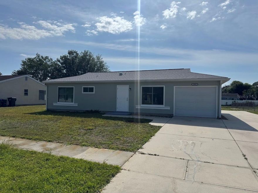 Seller is willing to assist with buyer’s closing costs. Don’t miss this updated 3-bedroom, 2-bath home with a bonus room-there’s a lot to like here! The home features updated windows, stylish cabinetry, and a refreshed kitchen with a brand-new stainless steel refrigerator and matching Whirlpool appliances. Tile flooring runs throughout, along with upgraded hardware, modern light fixtures, and ceiling fans in all bedrooms. Major updates include a roof (2019), electrical panel (2020), water heater (2018), and a recently serviced A/C (2011). The interior and exterior have been freshly painted, giving the home a clean, move-in ready feel. Outside, you’ll find a partially fenced yard, which is great for pets, plus an extended concrete parking pad for extra vehicles. Out back, there’s an additional concrete slab that’s perfect for grilling or setting up a BBQ area. Conveniently located just a short drive to restaurants, shopping, and everyday essentials. The Jockey Club community offers a clubhouse, fitness area, and a large pool, adding even more value. Put this one on your list, it’s worth a look!