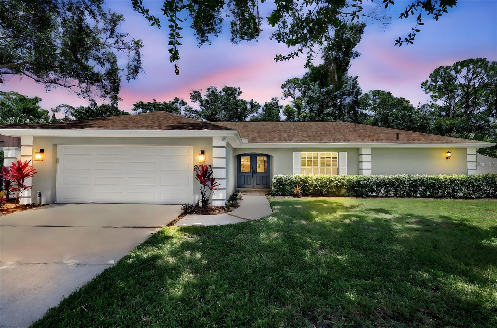 This beautifully maintained 3-bedroom, 2-bath pool home is nestled in the desirable Palm Aire Country Club neighborhood. Set on an oversized, private conservation lot, it features a new roof (2024), new HVAC (2024), resurfaced pool (2024), and no flood zone.
The home’s modern curb appeal includes fresh paint, professional landscaping, and a mosaic tile entry that leads to custom double doors. Inside, an open-concept layout with abundant natural light showcases luxury vinyl plank flooring, modern fixtures, and a striking floor-to-ceiling tiled electric fireplace. A glass chandelier adds elegance, while remote-controlled blinds offer both style and convenience.
The chef-inspired kitchen boasts custom 42-inch shaker cabinets, QUARTZ countertops, a large island with breakfast bar, stainless steel appliances, pantry, floating shelves, and subway tile backsplash. It flows seamlessly into the dining and living areas, perfect for entertaining. Sliding glass doors lead to a screened pool lanai, blending indoor and outdoor living.
The spacious primary suite features plush carpeting, direct lanai access, and a spa-like en suite with double vanity, walk-in shower, freestanding tub, and private water closet. Two generous guest bedrooms offer ample closet space, and the updated guest bathroom includes a Quartz double vanity and stylish tiled shower/tub.
The private backyard is surrounded by hedges, offering a serene setting for the freshly resurfaced pool and covered patio. Additional features include an interior laundry room with custom storage.
Optional memberships at Palm Aire Country Club offer golf, tennis, pickleball, swimming, and dining. Conservatory Park, just a short walk away, provides access to kayaking, fishing, trails, and more.
Minutes from Palm Aire Country Golf Club, top schools, UTC shopping, dining, St. Armand’s Circle, and Siesta Key and Anna Maria Island beaches—this home combines luxury, convenience, and location!