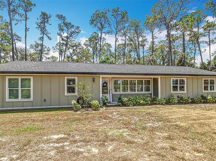 FULLY REMODELED 3/2 on Big Pine Island, a small community of single family homes surrounded by the Ocklawaha River which is the principal tributary of the St Johns River and part of the Harris Chain of Lakes. Community boat ramp less than 50 yards from your circular crushed rock driveway makes it easy to launch your airboat, fishing boat or kayaks anytime. From the moment you enter this home, you will love the bright open floor plan with brand new luxury vinyl floors, new lighting fixtures, new leaded glass front door, ring doorbell, new paint, new bathrooms and a five star kitchen with SS Appliances, wood cabinetry, gas range and stylish granite countertops. Next to the kitchen is a custom designed floor to ceiling pantry that mimics the kitchen and offers a wine cooler refrigerator and tons of storage for just about anything!! Both bathrooms have brand new vanities, lighting and new tile work that is top notch. This island beauty sits on just under an acre of land and is surrounded by natural landscapes and Florida wildlife. Plenty of room for toys, boats, camper, tractor etc. and parking up to eight vehicles with a 22' x 22' TWO CAR ATTACHED GARAGE AND A FOUR BAY DETACHED METAL 26' x 48' WORKSHOP/GARAGE with 110 & 220 power. Three roll up doors measuring 8' wide x 12' high and one 6' x 9' door along with a side entry door make this the perfect spot for all your cars, boats, motorcycles and other toys. Enjoy the 12' x 24' covered screened lanai off back of home overlooking the detached garage. Other updates include new roof in 2020, newer windows and sliders. Short drive to hospitals, golfing, shopping & restaurants of all kinds in The Villages which is only a few miles away. If you're tired of the hustle and bustle then escape the city and make this special place your private oasis! Call today for your private showing.
