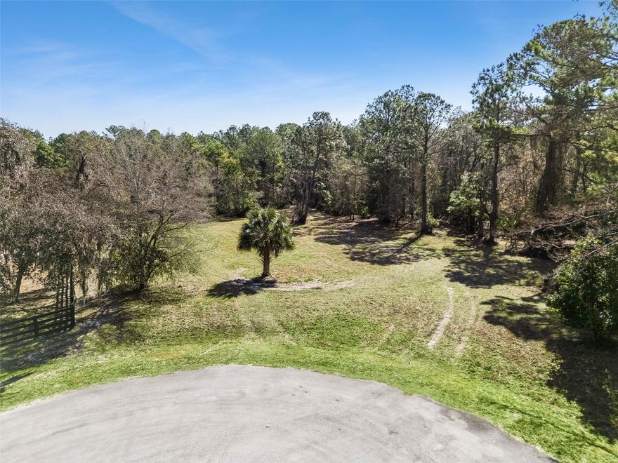 Under contract-accepting backup offers. Welcome to an exceptional 5+ acre homesite on highly desirable Deer Park Ave in Eustis, one of the last remaining vacant tracts in an established enclave of estate-caliber custom residences, many exceeding $1,000,000 in value. This property offers the flexibility today’s buyers want: no HOA, no required timeframe to build, and bring your own builder. Deed restrictions maintain the integrity of the neighborhood, allowing one dwelling per lot with a minimum of 1,500 square feet of living area and a minimum two-car garage (attached or detached). Barns and stables are permitted. Manufactured homes are not allowed. Approximately 2.7 acres are protected by a conservation easement, preserving natural views and providing a habitat for native wildlife, leaving plenty of room to build. The property sits at the end of Deer Park Ave and directly borders the Lake Norris Conservation Area, managed by St. Johns River Water Management District. This adjacency ensures privacy and peace of mind, no future development behind you. Deer, turkey, and other wildlife are frequent visitors, enhancing the tranquil, Old Florida setting. Despite its private, rural atmosphere, the location remains highly convenient: 8 miles (12 minutes) to Publix shopping center, 9 miles (14 minutes) to US Hwy 441 with dining and retail,12 miles (20 minutes) to downtown Mount Dora. A rare opportunity to build your custom home in a protected natural setting while remaining close to everyday amenities. If you’ve been searching for acreage, privacy, and long-term value stability, this Deer Park Ave tract delivers. Lender & Builder referrals available.