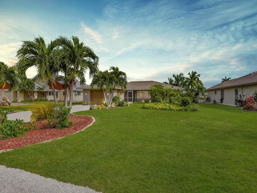 Discover exquisite waterfront living in this stunning Fort Myers residence. Bright, sunlit interiors highlight the stunning kitchen with custom cabinets, granite countertops, stainless steel appliances, and breakfast bar seating. This property features three bedrooms, two baths. The primary suite boasts a luxurious ensuite bathroom with a spacious walk-in shower and modern custom cabinetry. Outside, lush landscaping sets the stage for an outdoor paradise. Enjoy mesmerizing canal views from the infinity-edge pool or relax in the covered sitting area. A generous deck and boat dock with a lift complete the waterfront dream. Located on a picturesque street near Tidewater Island, this home promises sophistication and convenience. Embrace the allure of waterfront living while being close to Southwest Florida's vibrant culture, stunning beaches, the SWFL airport, and endless recreational opportunities. Call today for your private viewing!