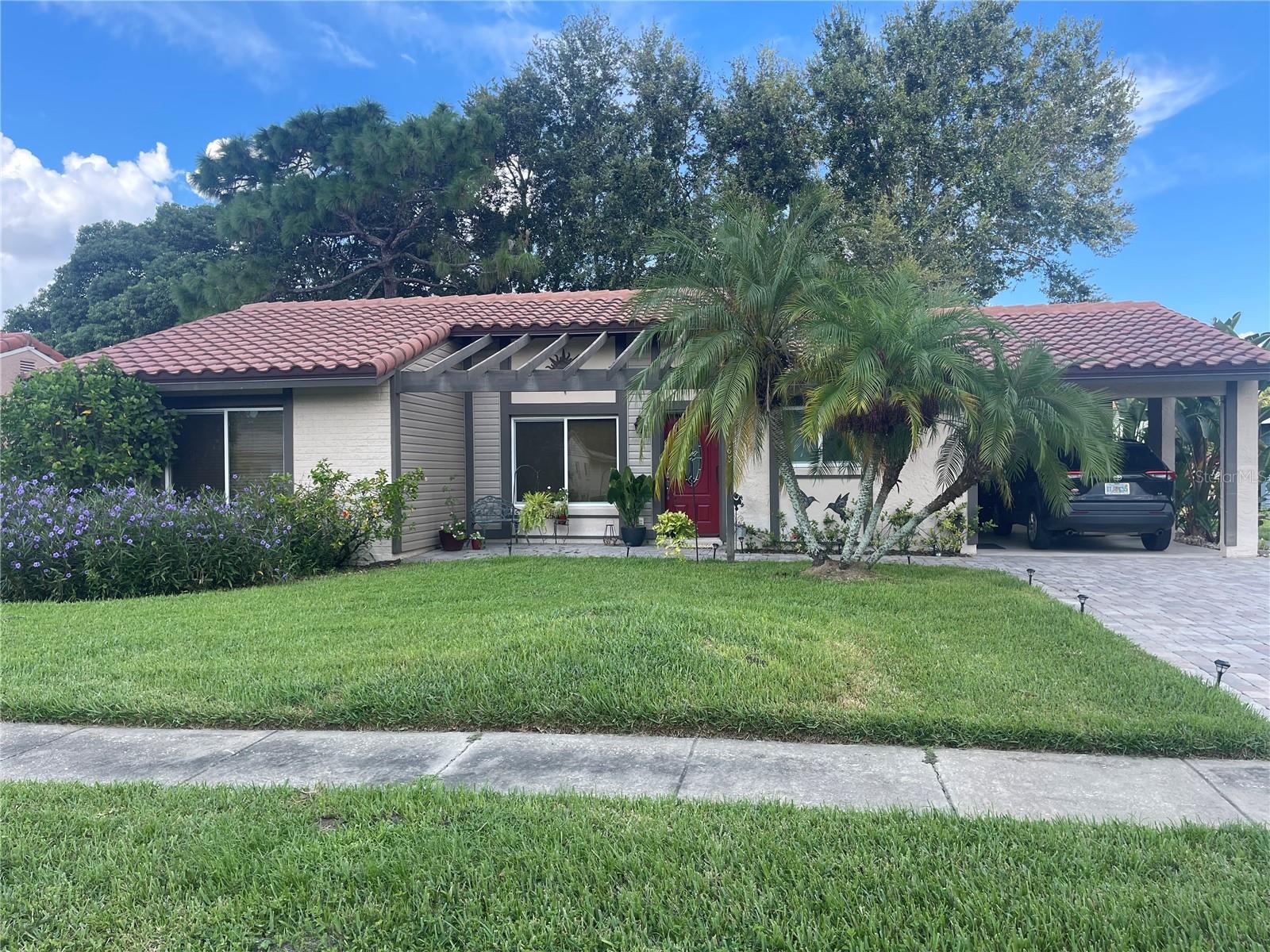 Really 3 bedrooms here-the house features 2 large bedrooms PLUS dedicated an OFFICE! This remarkable gem features a very rare private backyard in Williamsburg. Right next to Sea World and Aquatica, as well as super centrally located to EVERYTHING in Orlando. House can be left partially furnished or unfurnished. This secluded part of Williamsburg is a peaceful residential area. The house has high cabinets, walk in showers, large closets, and the bright extra room with a view of the garden and direct access outside can be a dedicated office, craft room, study, guest bedroom or playroom. Do not miss this opportunity to get a renovated HOUSE for the price of a condo in an mazing location! Realtor cooperation is welcome and appreciated. Lawn care is included in the rent!