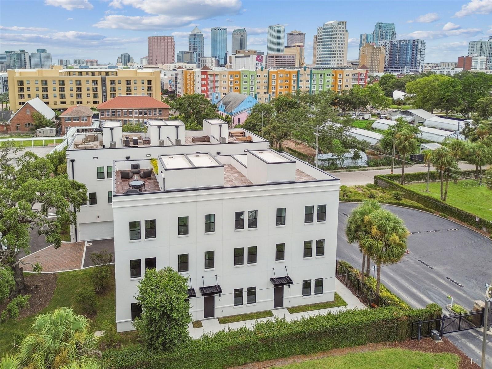 Move-in ready units available now! Your Canvas Awaits! This two-phase collection of 79 industrial-chic city homes is inspired by the bold architecture and electric energy of Ybor City. Drawing from the historic brick cigar factories and converted warehouses nearby, these homes reflect the creative, urban vibe of the neighborhood—where artist studios, co-working spaces, and some of Tampa’s hottest restaurants and nightlife thrive. Each residence features a private street-level entry, two-car garage, and a rooftop terrace with stunning views of downtown, Ybor City, and the Tampa skyline. Inside, the aesthetic is raw, modern, and effortlessly cool. Think 10-foot ceilings, exposed block concrete walls, and sunlit spaces—a true blank canvas for your personal style. The ground floor offers polished concrete floors, a sleek ensuite bedroom and bath, plus easy garage access. The second level is all about open-concept living, featuring a massive chef-worthy kitchen island—perfect for hosting or crafting the ultimate cocktail. On the third floor, the owners’ suite radiates main character energy, complete with a walk-in closet built for sneakerheads and style icons alike. Right outside your front door, the best of Ybor City’s nightlife, restaurants, and culture awaits. Hop on the streetcar to downtown Tampa, explore Channelside and Water Street, or catch a concert at Amalie Arena. For a laid-back day, bike to Armature Works, stroll the Riverwalk, or hit Sparkman Wharf for killer eats and waterfront views. As Tampa booms, Ybor City is at the heart of an urban revival. The Gas Worx master development is only steps away, and will continue to reinvigorate this already sought-after neighborhood while honoring its rich history and artistic soul. Canvas GWX brings it all together; design-forward city homes built for those who want to live in Tampa’s most vibrant district. With move-in units available immediately, now’s the time to secure your spot. Contact us today for pricing, incentives, and to schedule your private tour!