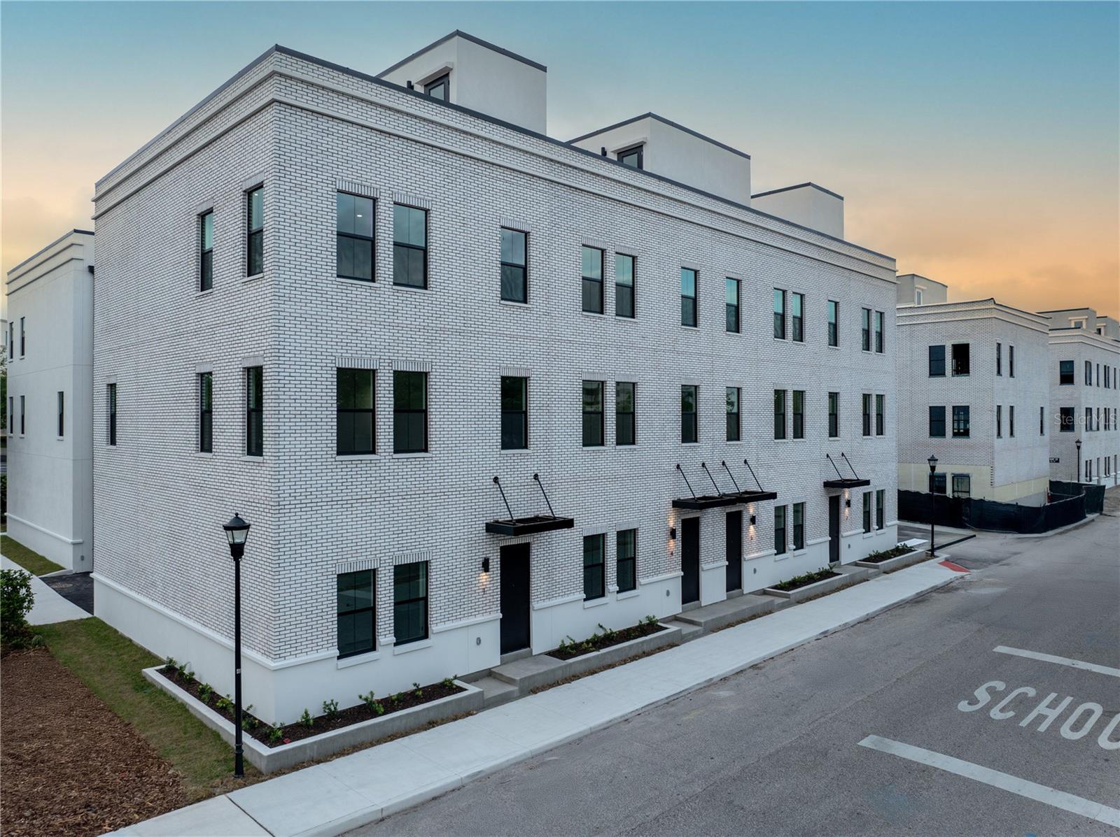 Move-in ready units available now! Your Canvas Awaits! This two-phase collection of 79 industrial-chic city homes is inspired by the bold architecture and electric energy of Ybor City. Drawing from the historic brick cigar factories and converted warehouses nearby, these homes reflect the creative, urban vibe of the neighborhood—where artist studios, co-working spaces, and some of Tampa’s hottest restaurants and nightlife thrive. Each residence features a private street-level entry, two-car garage, and a rooftop terrace with stunning views of downtown, Ybor City, and the Tampa skyline. Inside, the aesthetic is raw, modern, and effortlessly cool. Think 10-foot ceilings, exposed block concrete walls, and sunlit spaces—a true blank canvas for your personal style. The ground floor offers polished concrete floors, a sleek ensuite bedroom and bath, plus easy garage access. The second level is all about open-concept living, featuring a massive chef-worthy kitchen island—perfect for hosting or crafting the ultimate cocktail. On the third floor, the owners’ suite radiates main character energy, complete with a walk-in closet built for sneakerheads and style icons alike. Right outside your front door, the best of Ybor City’s nightlife, restaurants, and culture awaits. Hop on the streetcar to downtown Tampa, explore Channelside and Water Street, or catch a concert at Amalie Arena. For a laid-back day, bike to Armature Works, stroll the Riverwalk, or hit Sparkman Wharf for killer eats and waterfront views. As Tampa booms, Ybor City is at the heart of an urban revival. The Gas Worx master development is only steps away, and will continue to reinvigorate this already sought-after neighborhood while honoring its rich history and artistic soul. Canvas GWX brings it all together; design-forward city homes built for those who want to live in Tampa’s most vibrant district. With move-in units available immediately, now’s the time to secure your spot. Contact us today for pricing, incentives, and to schedule your private tour!