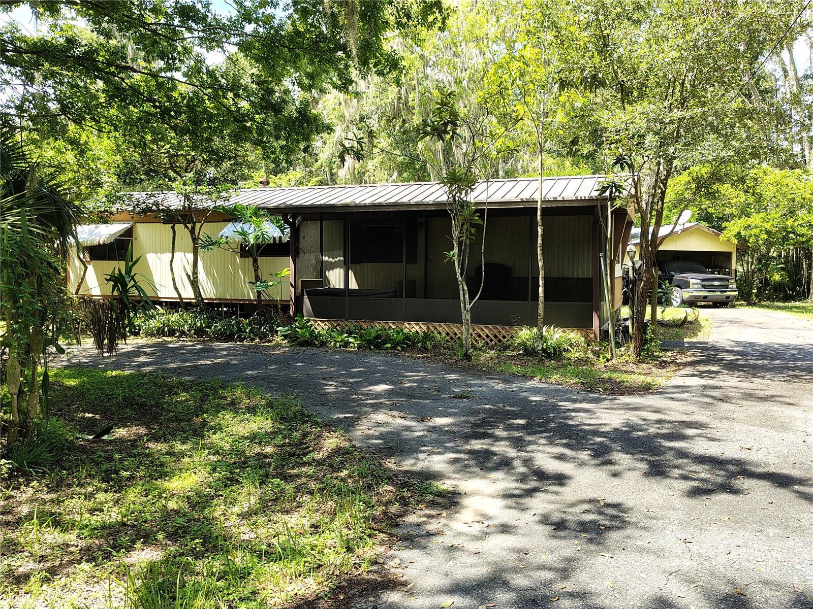 This home is situated on an oversized lot in an established neighborhood known for its quiet streets and community charm. It requires repairs, updates, and cosmetic improvements, presenting an excellent opportunity for buyers interested in renovation or investment projects. While the home needs work, it offers strong potential given its location and lot characteristics. Its location boasts extreme convenience being just minutes away, you'll find multiple boat ramps that provide easy access to Lake Panasoffkee-renowned for some of the best fishing in Florida. The lake flows into the scenic Withlacoochee River, where you can enjoy boating, kayaking, and the view of an abundance of native wildlife. Enjoy the small-town charm while still being just minutes from The Villages that hosts free nightly entertainment, golf courses, shopping, dining, and much more! You're also close to Florida’s west coast, offering waterfront dining, kayaking, fishing, beaches, and natural springs for the perfect weekend adventures. Convenient access to I-75 and the Florida Turnpike makes travel to Orlando’s theme parks and major airports a breeze. This home gives the perfect blend of comfort, privacy, and convenience to the Florida lifestyle. So, bring your imagination as it needs some love, elbow grease, and a good toolbox.