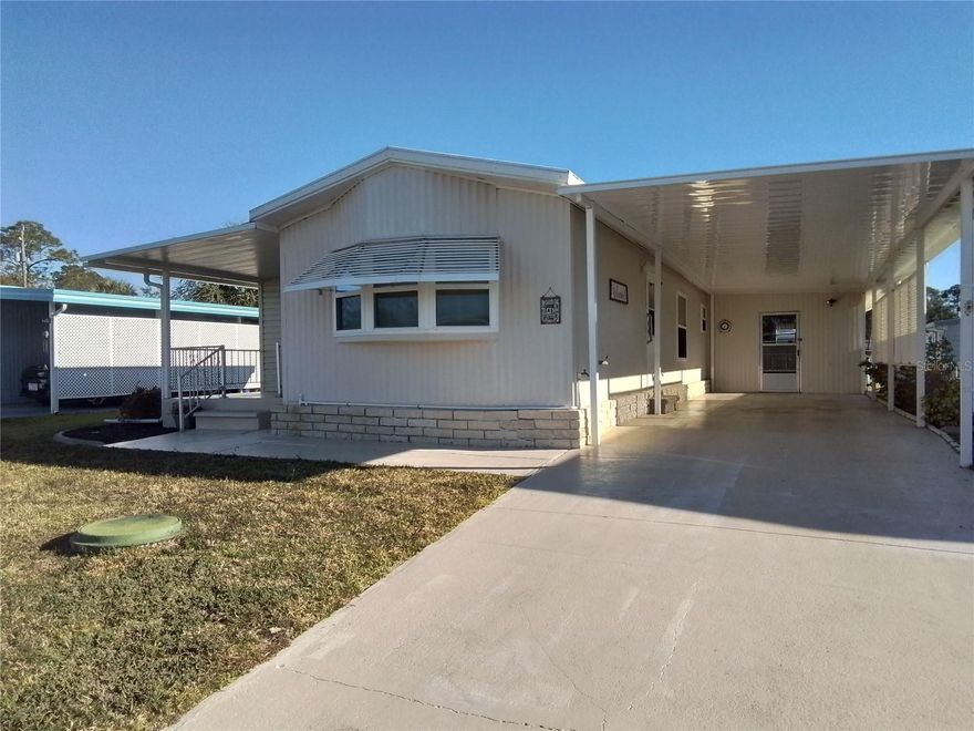 Cute as a button and TURNKEY for your immediate enjoyment! Welcome to 46 Kono Circle at Molokai, a 55+ community. Get to know your neighbors with the many activities offered or have a sit on your front porch and have a chat with them. This well maintained home has updates including windows, HVAC, vapor barrier, refrigerator and a new carport. The home has a transferrable termite bond with Massey Services. An open, inviting floor plan perfect for entertaining and enjoying life. A large workshop for tinkering or creating, and a large laundry area providing additional storage for your new home. This is one to see for yourself. Fully furnished with everything except your clothes, your toothbrush, and YOU!