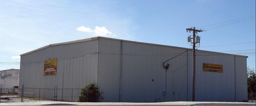 Flex Industrial building for sale. Located in NE Ocala with convenient access to major thruways, this industrial property offers an excellent opportunity for businesses seeking a versatile and well-equipped facility. Situated on 0.84 acres and zoned M-2 (Medium Industrial), the property features a 10,290 square foot steel frame metal building with the flexibility to service a variety of industrial uses. Key features of the building include fire suppression, floor drainage, and 25-foot wall height, and ample power. The building includes drive-in access via two grade-level doors (12x12 and 8x10), a truck well for efficient loading and unloading, and approximately 720 square feet of office space. Additional amenities include two restrooms and mezzanine storage. This property’s strategic location makes it ideal for warehousing, distribution, light manufacturing, or similar industrial applications.