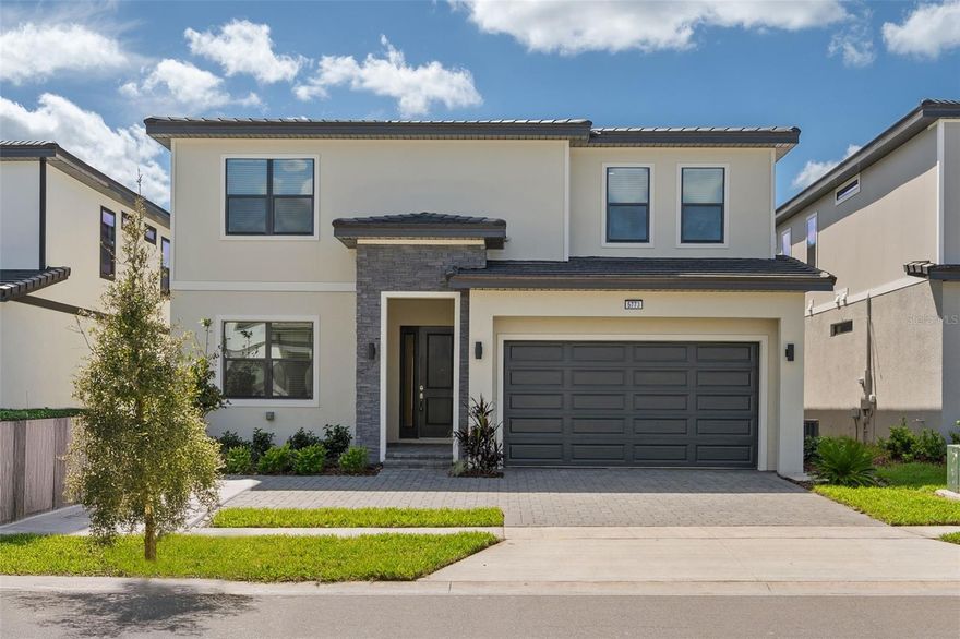 Don’t miss this luxury vacation home opportunity at Paradiso Grande! This remarkable new construction with PREMIUM LOT, never occupied features an 8-bedroom, 8-bathroom Lagoon II floor plan, complete with an inviting loft area perfect for relaxation or entertainment. Located in the premier vacation community by Park Square Homes in Orlando, you’ll be just minutes from SeaWorld, Universal Studios, premium outlets and Disney. This property boasts amazing features, including additional laundry rooms on each floor, two refrigerators and dishwashers, granite countertops, gray cabinets, and a screen-enclosed pool. The seller has added numerous upgrades during construction, such as a Summer Kitchen Pre-Plumb with hot/cold water, drain pre-plumb, exterior J-box, and gas drop to elevate your outdoor entertaining experience. The upgraded 15x30 pool includes a spa and fountains, along with four flush-mount can lights in all bedrooms. Step outside to your private pool area, where you can enjoy stunning water views. Key features include an EV car charger and gas heaters for both the house and pool, ensuring comfort year-round. The Summer Kitchen pre-plumb is installed for your convenience. Inside, the open-concept kitchen is a chef’s dream, equipped with two refrigerators, two dishwashers, granite countertops, and elegant gray cabinetry. The first-floor master suite adds convenience, while the transformed 2-car garage doubles as a spacious game room. Paradiso Grande offers exclusive access to the luxurious Aquarius Clubhouse, featuring a resort-style pool, lazy river, café, game room, and fitness center. This property is perfect for both short-term rentals and long-term living. Don’t miss your chance to own this exceptional property in the heart of Orlando!