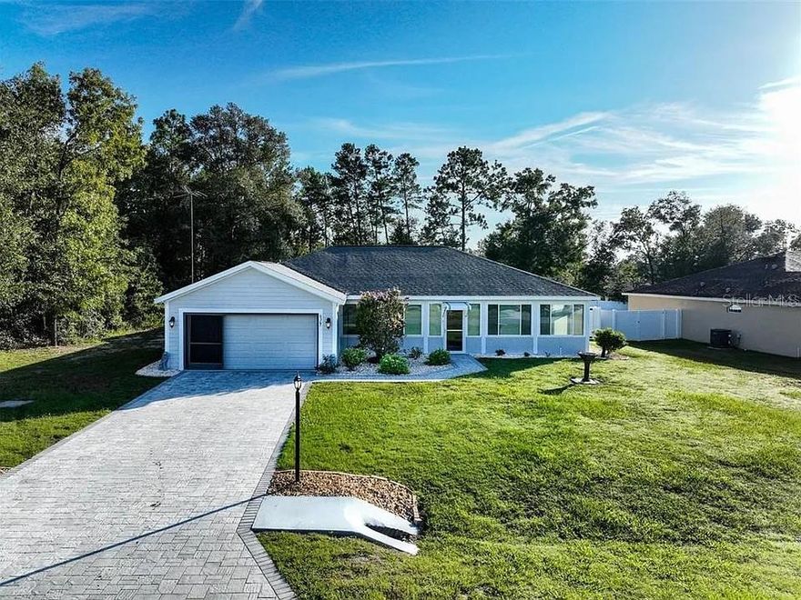Welcome to Kingsland Country Estates, one of Southwest Ocala's most sought-after communities! This beautifully
maintained 3-bedroom, 2-bath home offers 1,602 sq ft of comfortable living space (2,425 sq ft total under roof) and sits
on a spacious 0.33-acre lot with a 6-foot vinyl privacy fence. Built in 2018, this home combines modern finishes with
thoughtful design inside and out. Step into a stylish interior featuring ceramic tile flooring throughout, a kitchen
equipped with solid wood cabinets, granite countertops, and an inside laundry room for added convenience. The
custom paver driveway and walkway lead you to an enclosed front porch, perfect for morning coffee, while the
enclosed lanai provides a quiet retreat overlooking your private backyard oasis. Enjoy year-round relaxation in the
fully screened, solar-heated pool with a custom paver patio, ideal for entertaining or unwinding in peace. Two storage sheds provide plenty of space, including a 12x20 shed with a full pull-up garage door for larger items or workshop potential.