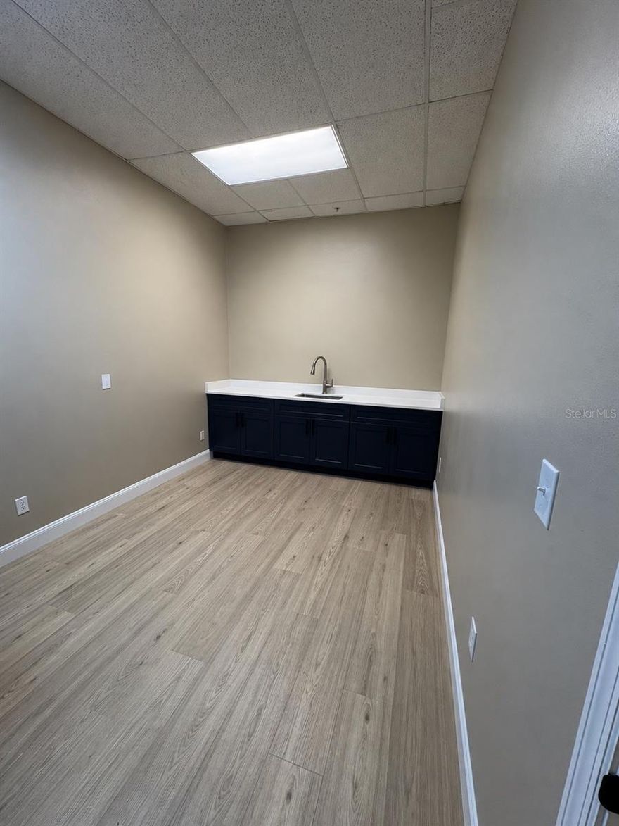 Versatile Commercial Space – Perfect for Wellness or Beauty Services ?
This beautifully finished space offers a clean, modern setting ideal for a variety of professional uses. Featuring durable wood-look flooring, neutral tones, and updated cabinetry with a sleek countertop and sink, this unit is both functional and inviting.
Perfectly suited for a facial studio, massage therapy, esthetics, or other wellness services, the layout provides a private, quiet environment designed to create a relaxing experience for clients.
The built-in cabinetry and sink add convenience for day-to-day operations, while the bright overhead lighting ensures a professional workspace.
Whether you’re launching a new business or expanding your current one, this flexible space offers the perfect blend of comfort, style, and practicality.