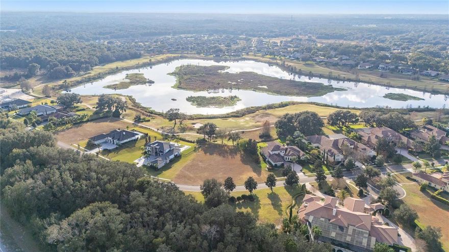 Build the estate of your dreams on this exceptional, oversized homesite and embrace the refined elegance of golf and country club living within the distinguished community of RedTail. Positioned along the exclusive Estates Ridge Drive, this expansive .82-acre parcel offers impressive frontage with a sought-after northeast orientation, ideal for capturing soft morning light and creating a serene outdoor living experience. Cleared and ready for construction, the property presents a rare opportunity to bring a custom vision to life with ease. Included are striking architectural plans for a modern single story residence encompassing over 5,700 square feet of thoughtfully designed living space, blending sophistication, comfort, and seamless indoor/outdoor living. Building within a premier golf and country club community like RedTail offers an unmatched lifestyle defined by privacy, prestige and everyday luxury. Residents enjoy access to a championship golf course set among rolling hills and natural beauty, along with an elegant clubhouse featuring fine dining, a full-service fitness center and rejuvenating spa amenities. Har-Tru clay tennis courts, scenic recreational and biking trails, and golf cart-friendly streets create a vibrant yet relaxed atmosphere designed for recreation and connection. Beyond the gates, the location offers exceptional convenience to the charm of Mount Dora, the energy of downtown Orlando and effortless access to major highways, making travel to world-class dining, shopping, entertainment, beaches and international airports seamless. This is more than a homesite. It is an opportunity to craft a legacy residence within a community that elevates every aspect of daily living.