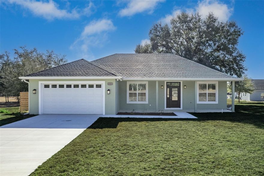 Welcome to this beautiful custom-built home in Citrus Springs where luxury finishes and thoughtful design shine in every detail. This stunning 3-bedroom, 2.5-bath residence offers soaring ceilings and an open-concept layout ideal for both everyday living and entertaining. The spacious kitchen features gorgeous soft-close shaker style cabinets, granite countertops, abundant counter space, and premium Whirlpool appliances. A tray ceiling elevates the main living area, adding architectural charm and sophistication. The spacious primary suite is complete with a walk-in closet, dual vanity, and a custom walk-in shower. The mudroom/laundry room is conveniently located just off the 2 car garage and showcases a custom butcher block countertop with built-in desk area- the perfect drop zone or workspace. Luxury vinyl flooring flows seamlessly throughout the home, tying together the high-end finishes that truly make this property stand out. Enjoy peaceful mornings on your inviting porch or unwind in the evenings on your expansive covered back porch. Everything about this home says custom-built quality-and it's offered at an incredible value. Don't miss this opportunity to make this exceptional Citrus Springs home yours! There is an adjoining lot available for purchase. Builder will consider offering a privacy fence with acceptable contract. Citrus Springs is located in the Gulf Coast of west-central Florida, approximately one hour north of Tampa, 1.5 hours west of Orlando. Situated within the Nature Coast region, close to Inverness a quaint little town with shopping and restaurants, know for it's 46-mile Withlacoochee state biking trail. Citrus County has extensive rivers- water resources, including Crystal River known for it's great seafood and water recreation and Homosassa Springs which attract manatees in the winter. Enjoy a day of kayaking and pick up some fresh seafood for lunch. Vacation where you live in this charming, relaxing area of Florida.