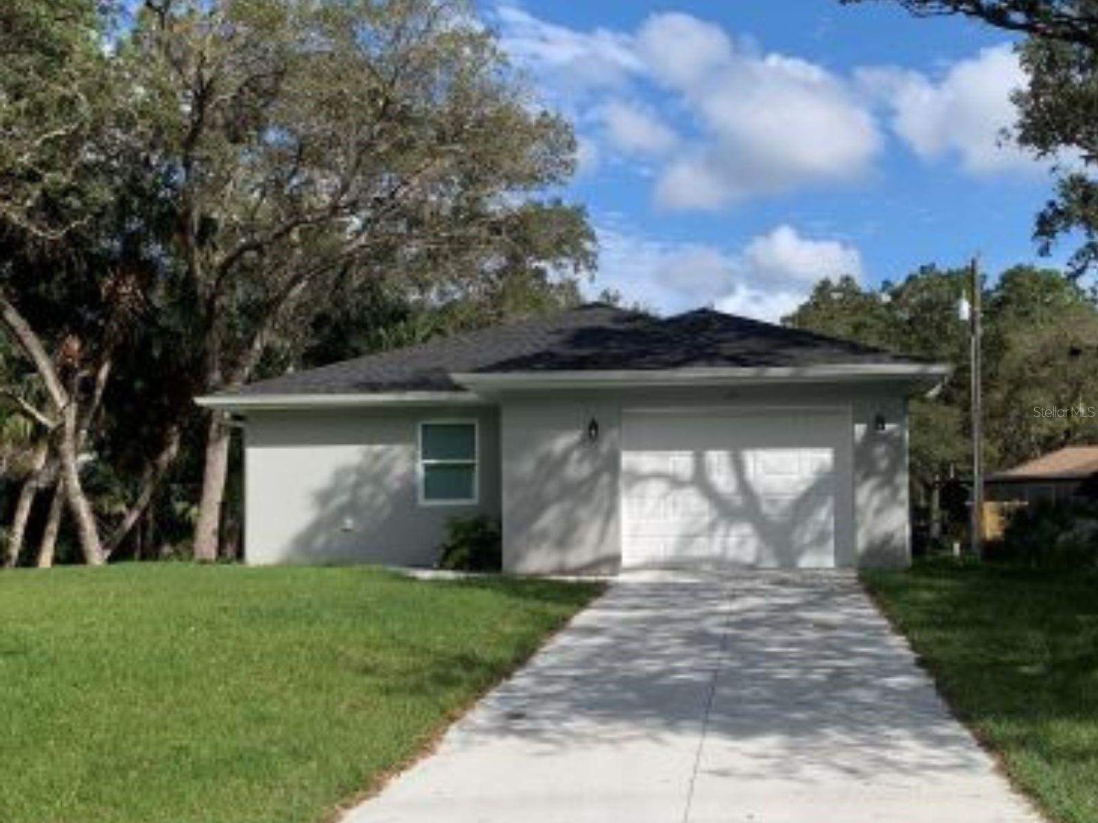 Super nice home in the north end of Port Charlotte
This house is in perfect move-in condition. Everything is freshly painted and well cared for. The house looks brand new. The home has a large open living area, which includes an open kitchen with a nice chopping block top kitchen island. Additionally, the kitchen features ample cabinet and counter space, complemented by stainless steel appliances and pendant lighting over the island.
The backyard is heavily wooded, and a country-screened lanai extends off the kitchen where you can relax and enjoy nature.
The bedrooms are very spacious. The main bedroom has two walk-in closets. The main bathroom has dual sinks and a nicely tiled shower. The guest bedrooms are roomy, and the guest bathroom has a shower and a bathtub.
There is a large laundry room with a front-load washer, a dryer, and a laundry washbasin. There is a large storage closet in the laundry room. The house has a one-car garage with a door that leads into the laundry room. This house is in a great location just a few blocks behind the North Port Walmart, but the home is located in a Port Charlotte zip code. The home has city water, and there is no HOA.